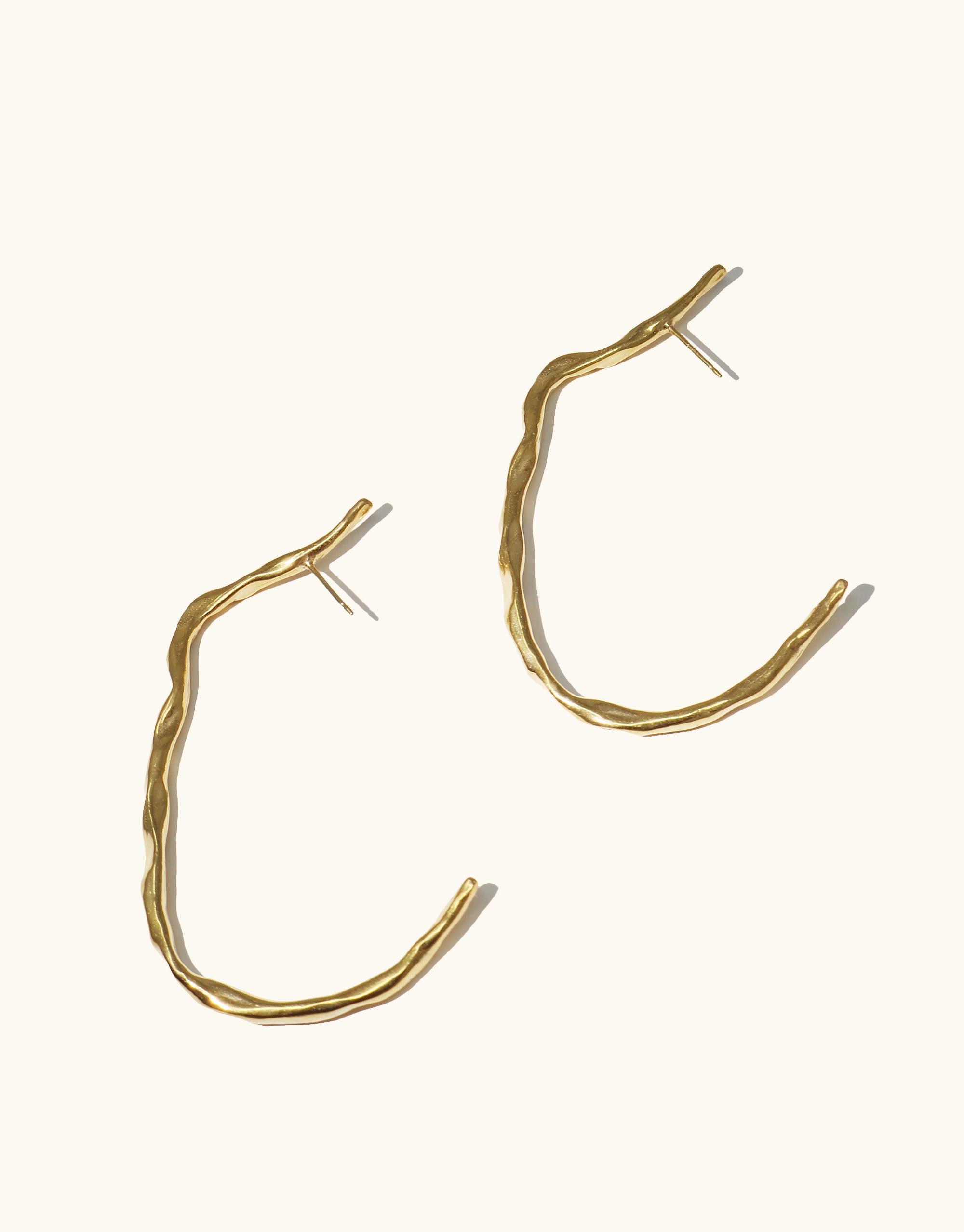 Vale Hoop Earrings featuring open back hoops with curved lines, inspired by canyon valleys, crafted in gold vermeil, 2.4 inches long. Part of CLED's eco-conscious Terrain Collection.