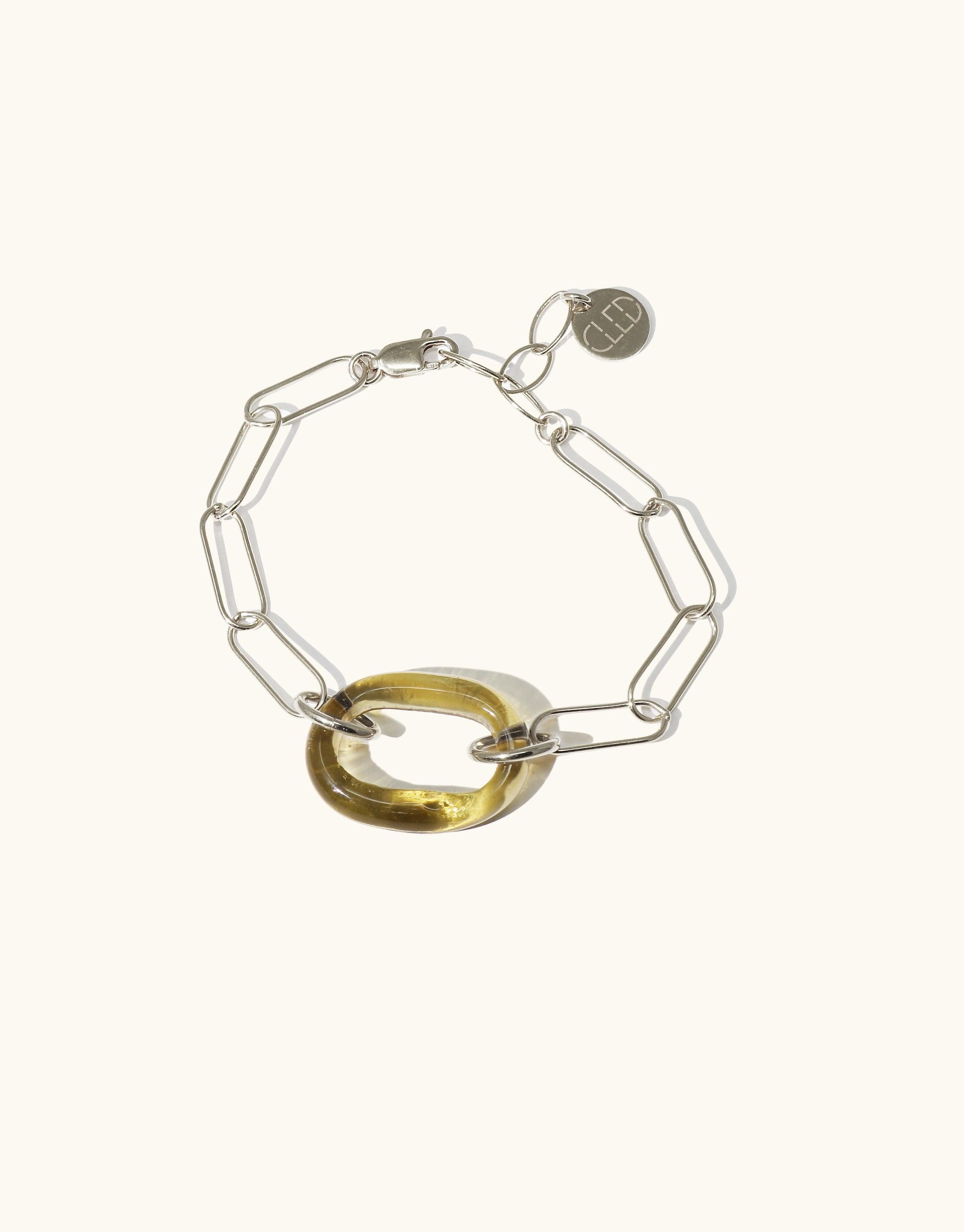 The Day Loop Bracelet features a hand-formed Eco Gem and an elegant oval chain, available in Sterling Silver or Gold Vermeil, showcasing CLED's eco-conscious craftsmanship in minimalistic design.