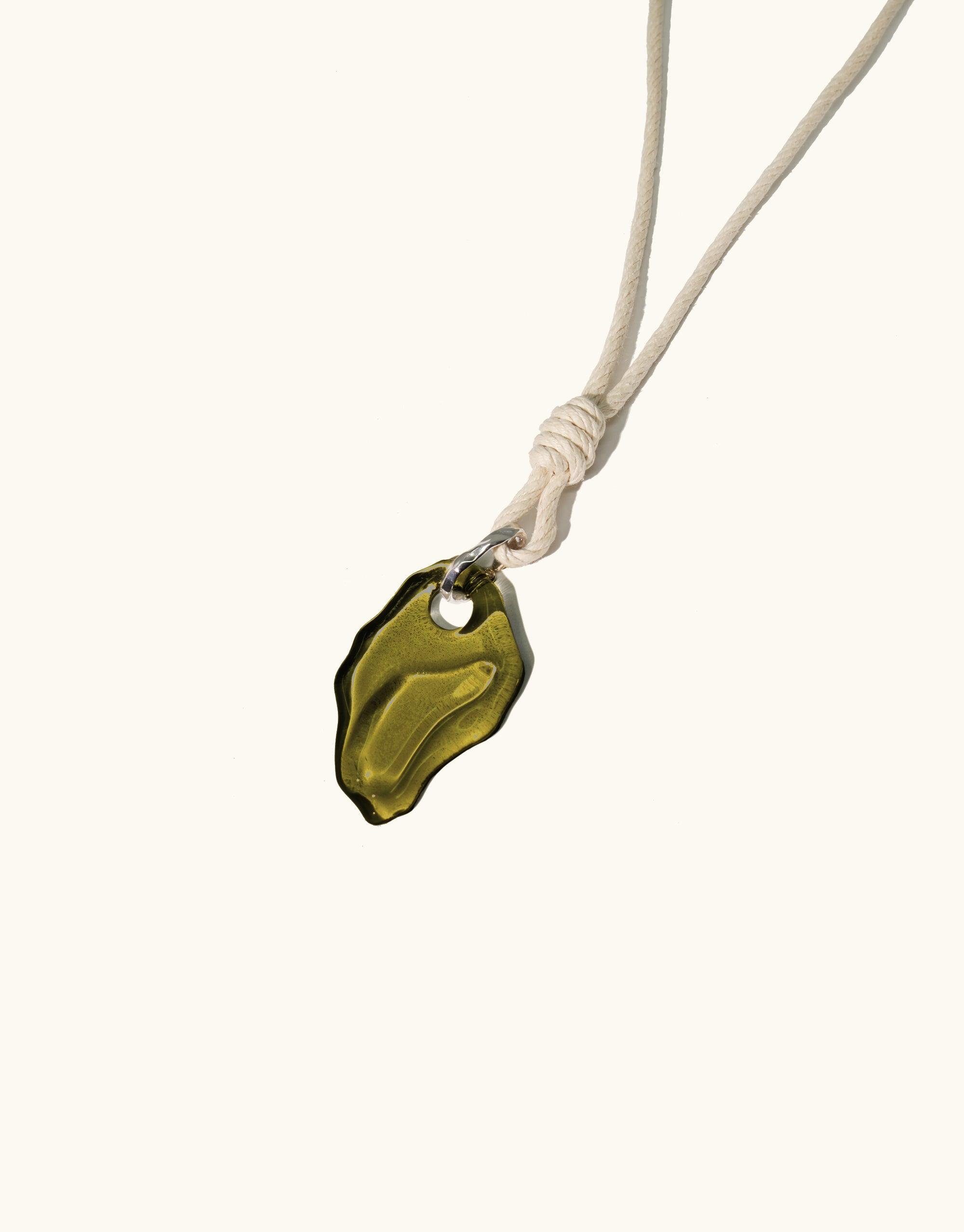Rope Knotted Necklace featuring an olive green, abstract glass pendant inspired by canyon terrain. Adjustable hemp cord with knotted accent. Handmade eco-friendly jewelry from repurposed glass bottles. Terrain Collection by CLED.