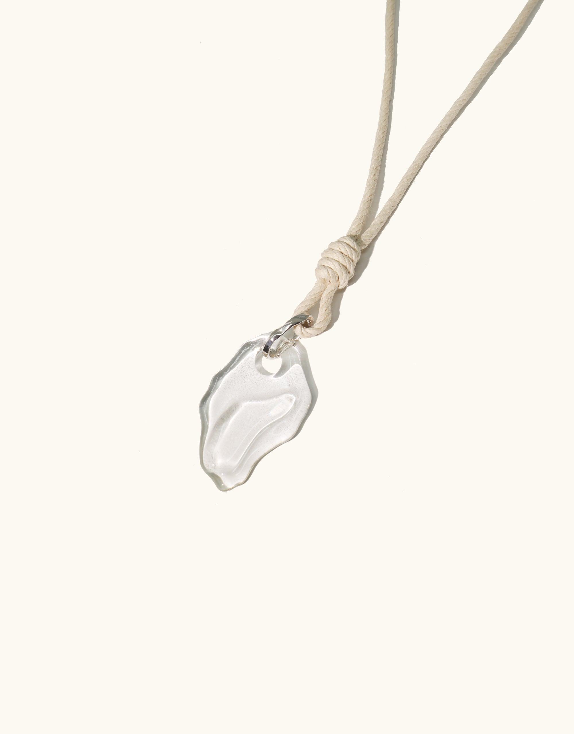 Rope Knotted Necklace featuring an abstract glass pendant inspired by canyon terrain, suspended on adjustable hemp cord. Handcrafted eco-friendly design made from repurposed glass bottles. Terrain Collection by CLED.