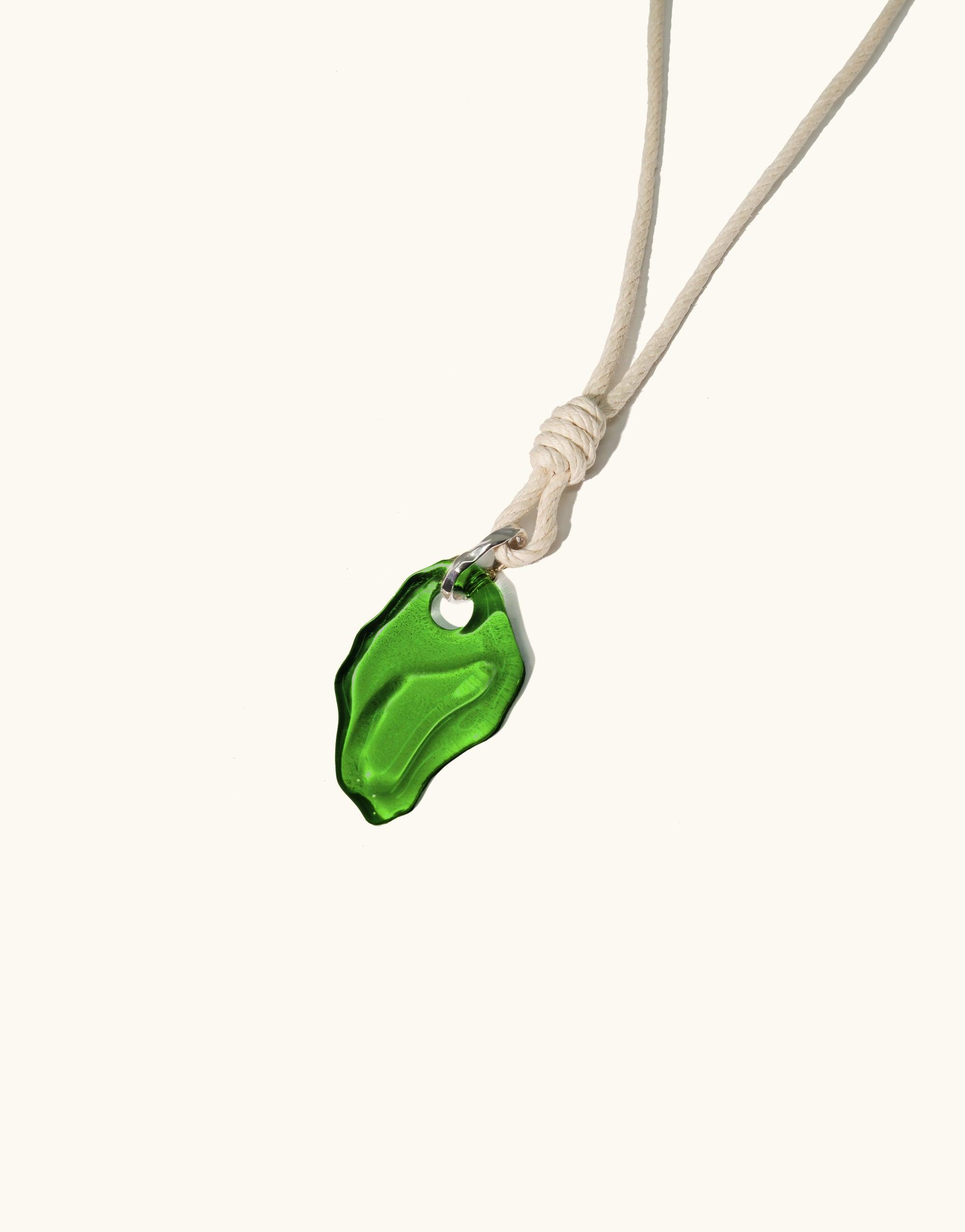 Rope Knotted Necklace featuring a vibrant green glass pendant, inspired by canyon terrain. Handcrafted eco-friendly jewelry with adjustable hemp cord. Sustainable fashion accessory showcasing repurposed glass. Terrain Collection by CLED.