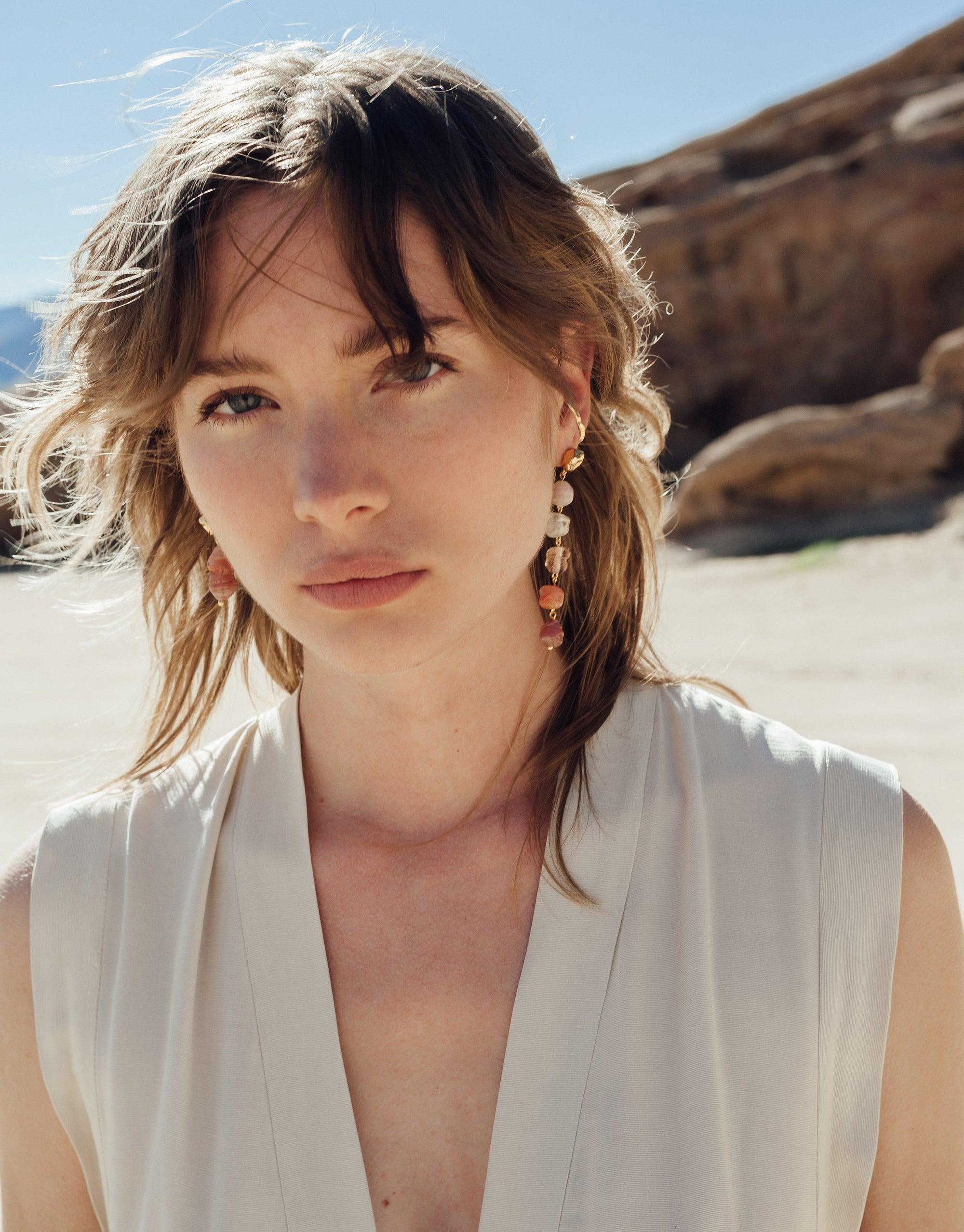 Elegant model wearing Shades of Nature Bloom Earrings, showcasing gradient colors inspired by canyon formations. Handcrafted eco-friendly jewelry made from upcycled glass, embodying natural beauty and sustainable luxury. Terrain Collection by CLED.