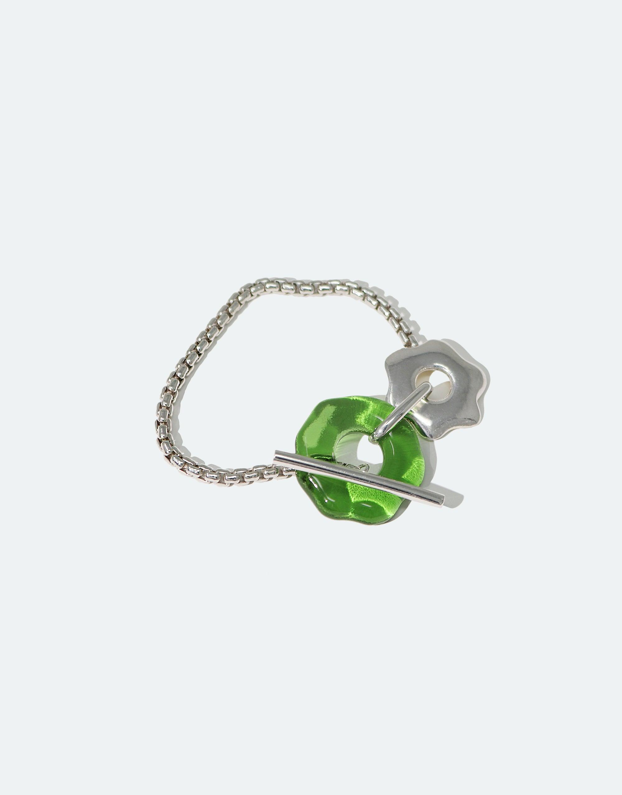 Avens Toggle Bracelet featuring silver chain with green eco gem toggle closure, inspired by Arctic flowers. Handmade sustainable jewelry from the Floating Glacier Collection by CLED