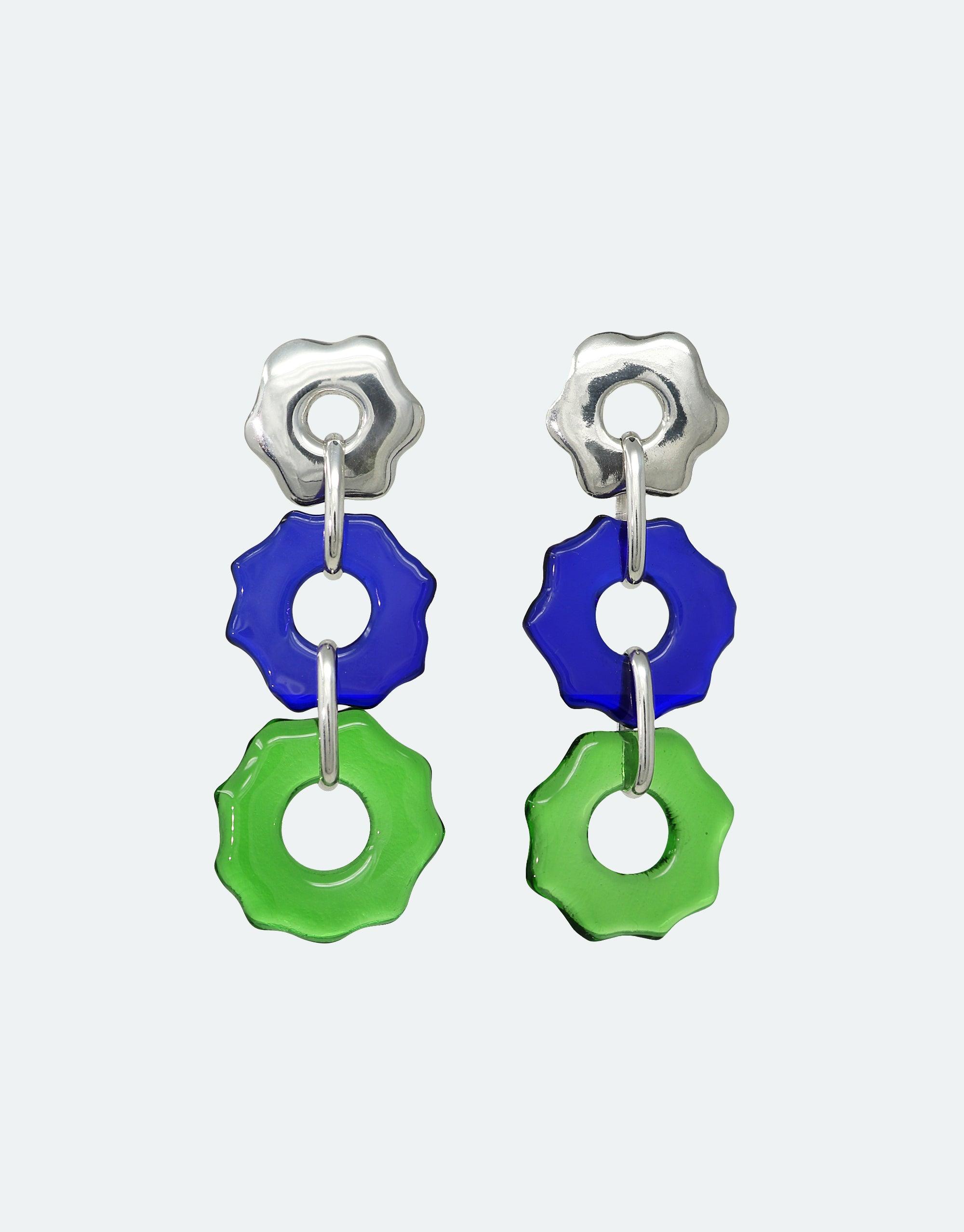 Avens Earrings Trio featuring three cascading flower-shaped charms in silver, blue, and green. Eco-friendly handcrafted earrings made from repurposed glass bottles. Unique sustainable jewelry design inspired by Arctic ecosystems. Perfect for environmentally conscious fashion lovers. CLED