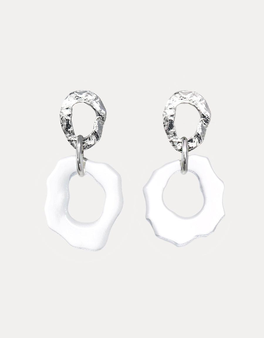 Elegant High Tide Earrings featuring textured silver hoops with wavy white glass pendants. Ocean-inspired statement piece handcrafted from eco-friendly repurposed glass. Sterling silver design showcasing sustainable luxury and artistic craftsmanship. CLED High Tide Earrings.