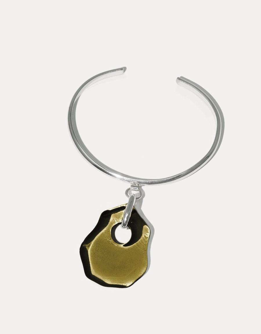 Elegant silver cuff bracelet with unique recycled glass pendant in olive green, inspired by coastal shapes. Handcrafted Coastline Drop Bracelet featuring sustainable materials and eco-friendly design. Perfect accessory for ocean lovers and eco-conscious individuals. CLED