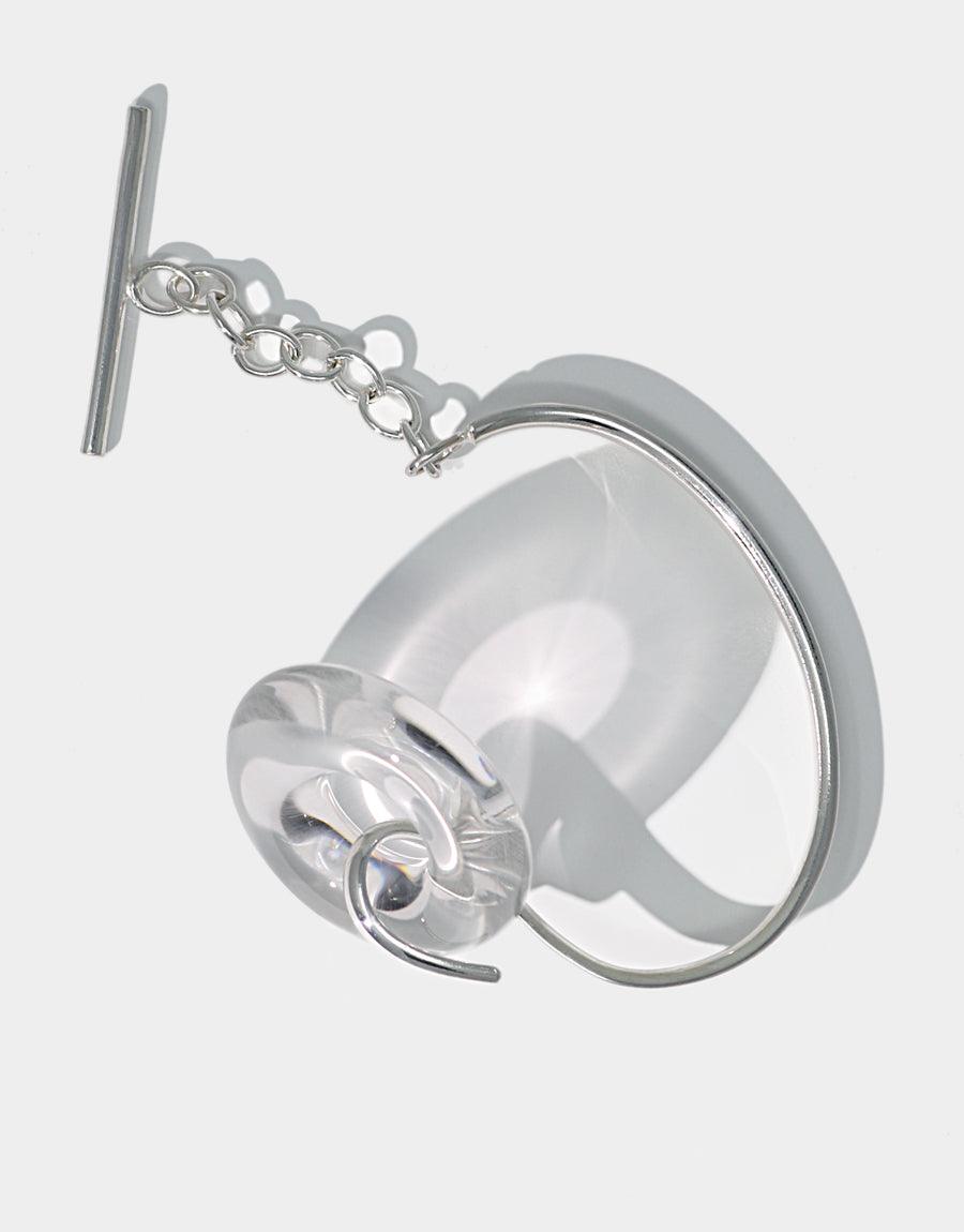 Sterling silver cuff bracelet with transparent glass torus and toggle closure, featuring a sleek design and handcrafted details. Opening Torus Toggle Bracelet by CLED, showcasing sustainable luxury and timeless elegance.
