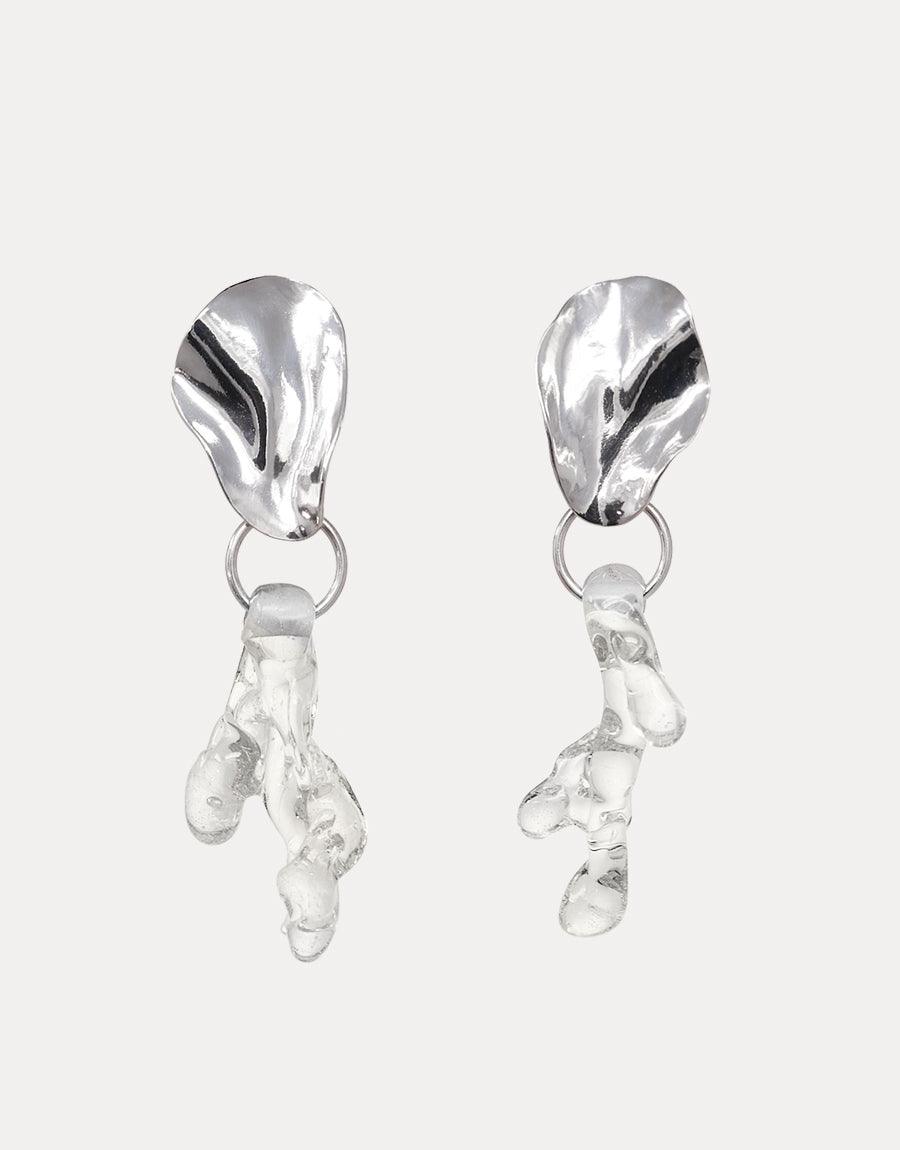 Coral Reef Earrings featuring sterling silver studs with organic-shaped clear glass pendants, handcrafted from recycled bottles. Elegant and eco-friendly statement piece inspired by marine ecosystems. Unique, artisanal design by CLED.