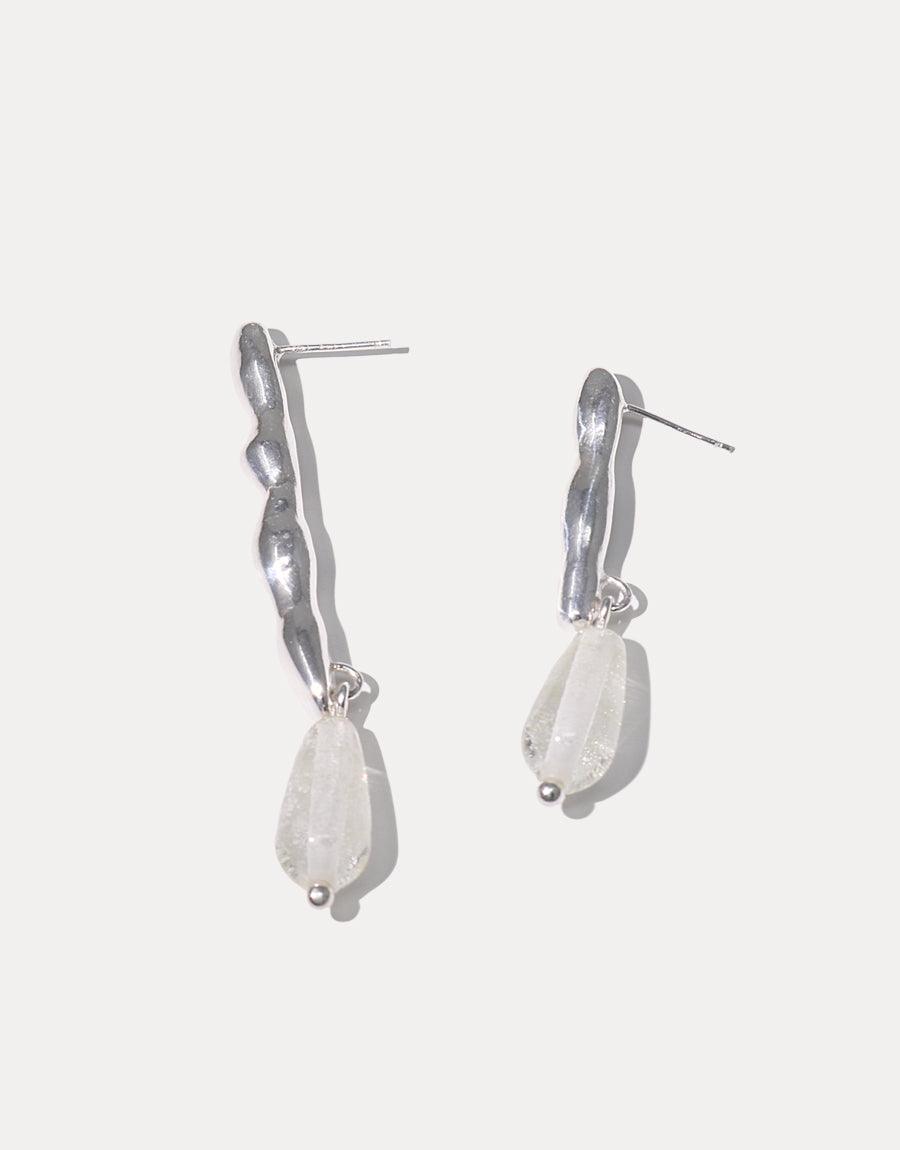 Water Earrings: Asymmetric sterling silver earrings with wavy, free-formed shapes, featuring Eco Gems repurposed from discarded glass. Handmade in Los Angeles, reflecting a mindful conservation message.