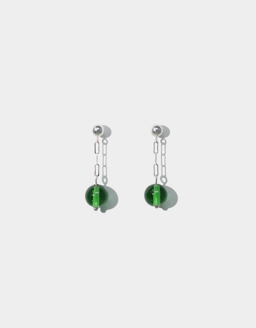 Small Drop Earrings featuring delicate silver chains suspending translucent green glass beads. Handcrafted sterling silver earrings with repurposed glass elements. Minimalist design perfect for everyday wear. Eco-friendly jewelry showcasing sustainable craftsmanship. Elegant and lightweight accessories by CLED.