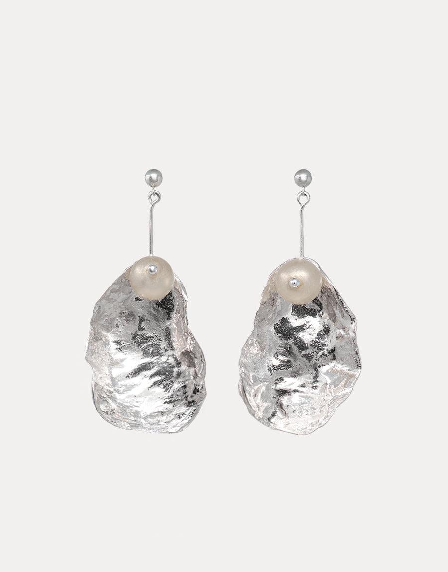Sustainable Eco Gem dangle earrings with textured metal shell and recycled glass pearl-like orbs. Not A Pearl Earring features sterling silver posts and handcrafted design, showcasing eco-friendly luxury jewelry. Available in two lengths, individually or as a pair. CLED