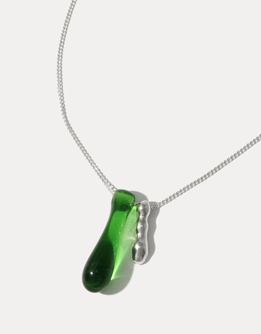 Elegant Drop Counts Necklace featuring a handcrafted green glass water drop pendant with a wavy sterling silver accent on a delicate chain, symbolizing the importance of water conservation. Eco-friendly jewelry made from repurposed glass bottles by CLED.