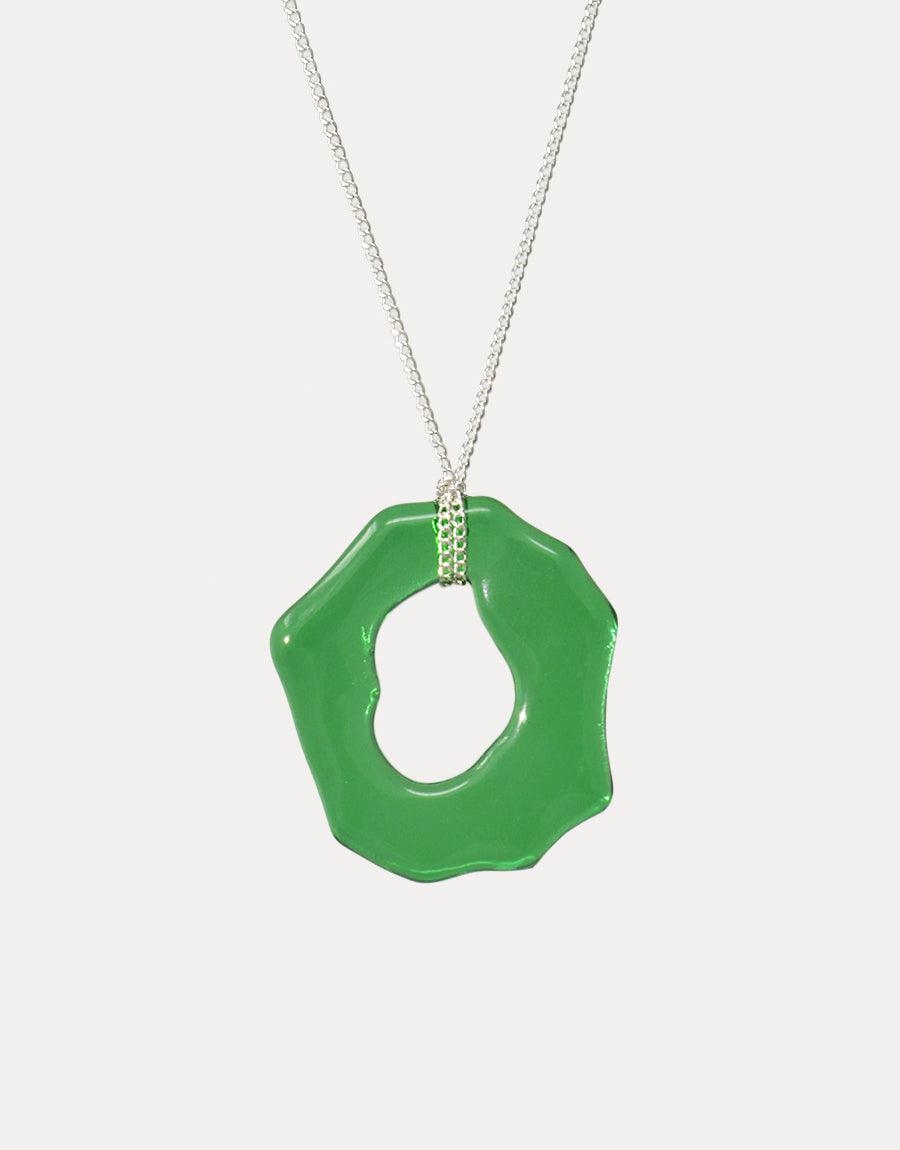 High Tide Necklace featuring a vibrant green organic-shaped pendant on a delicate silver chain. Handcrafted eco-friendly jewelry made from repurposed glass. Unique ocean-inspired design perfect for layering. Sustainable and stylish accessory by CLED.