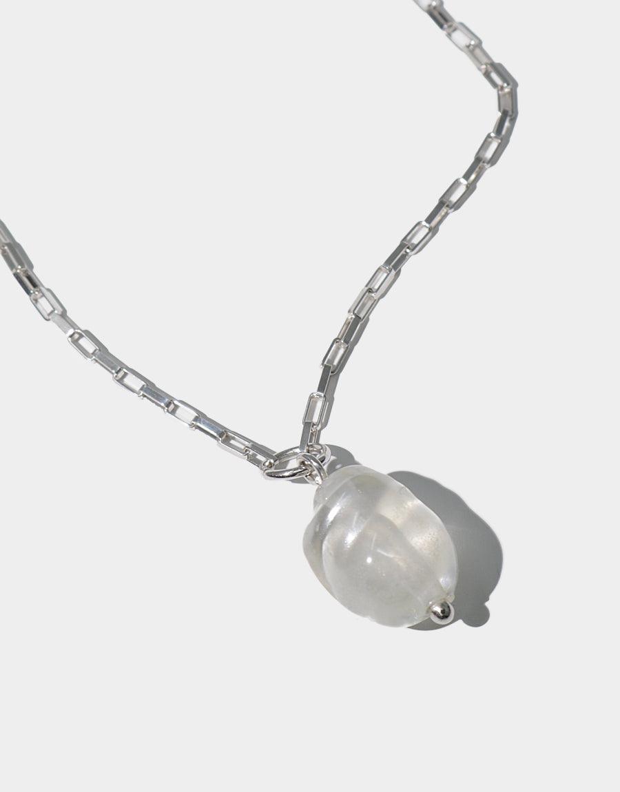 Natural Pearl Necklace featuring a single glass pearl pendant on a sterling silver square cable chain. Sustainable jewelry made from recycled materials. Elegant and versatile accessory for everyday wear. Handcrafted in Los Angeles. CLED Natural Pearl Necklace.