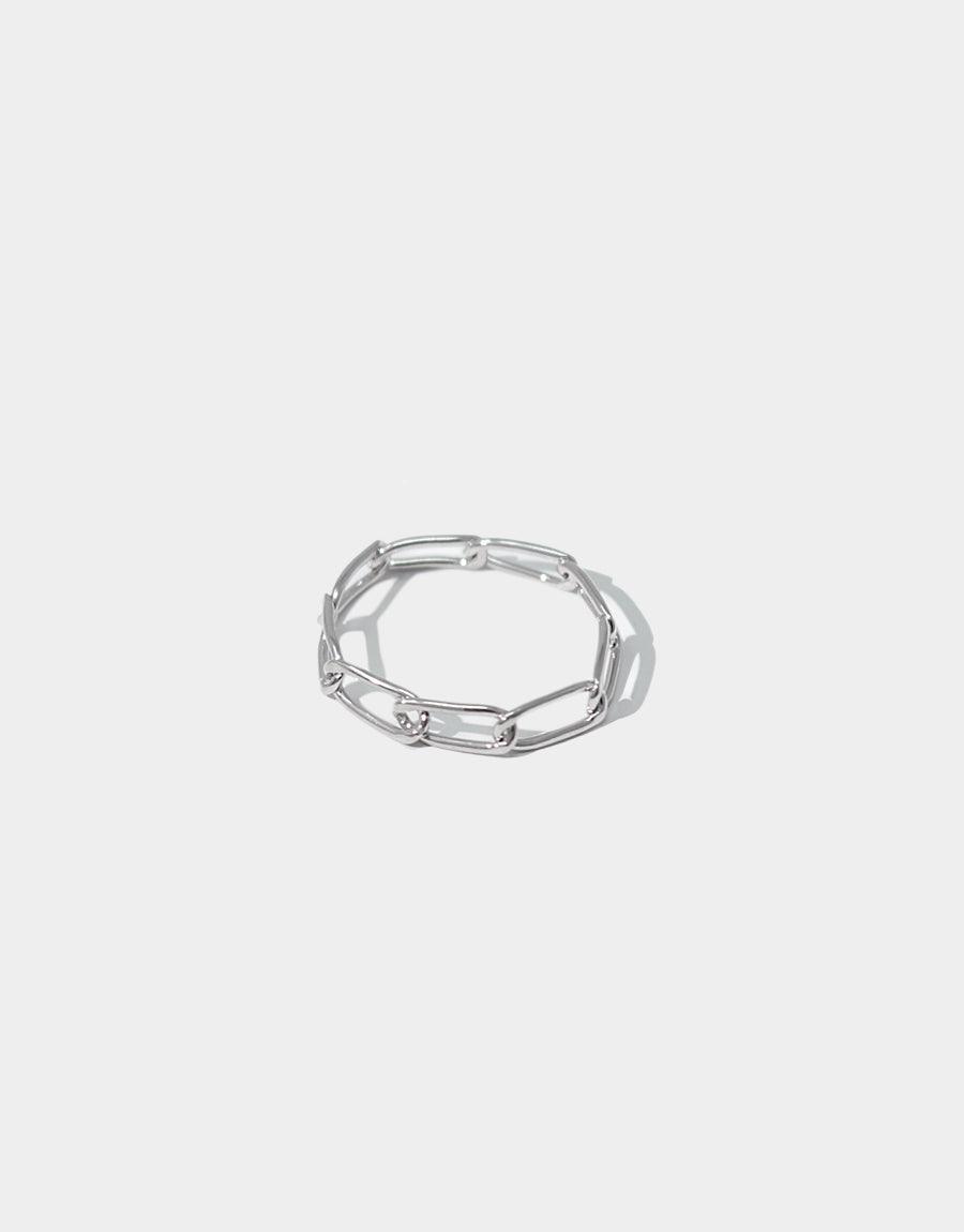 Sleek sterling silver chain link ring, Collapsible Chain Ring C, featuring interconnected oval links forming a versatile and adjustable band. Handcrafted design perfect for mix and match styling. Available in multiple sizes. Made in Los Angeles. CLED Collapsible Chain Ring | C