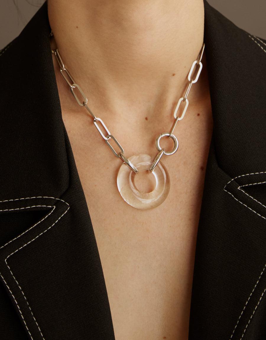 Sterling silver oval chain necklace with a unique hand-formed glass torus pendant, showcasing edgy and distinct design. The Opening Necklace features a repurposed glass gem for sustainable elegance. Handcrafted in Los Angeles by CLED.