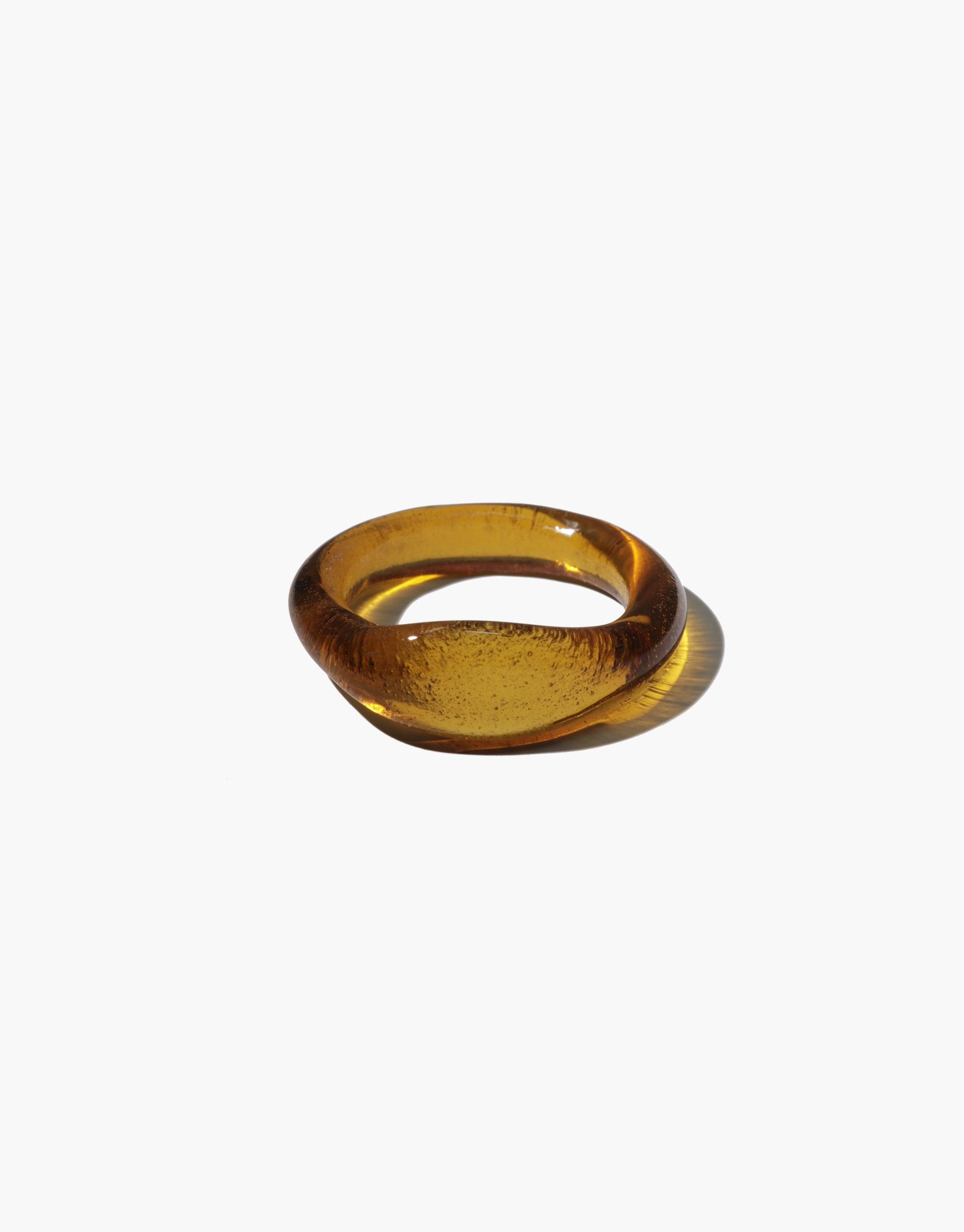 Amber-colored Signet Ring Original crafted from eco-friendly repurposed glass, showcasing a sleek and minimalist design. This handmade piece from the Messenger Collection embodies sustainable luxury and modern elegance. CLED