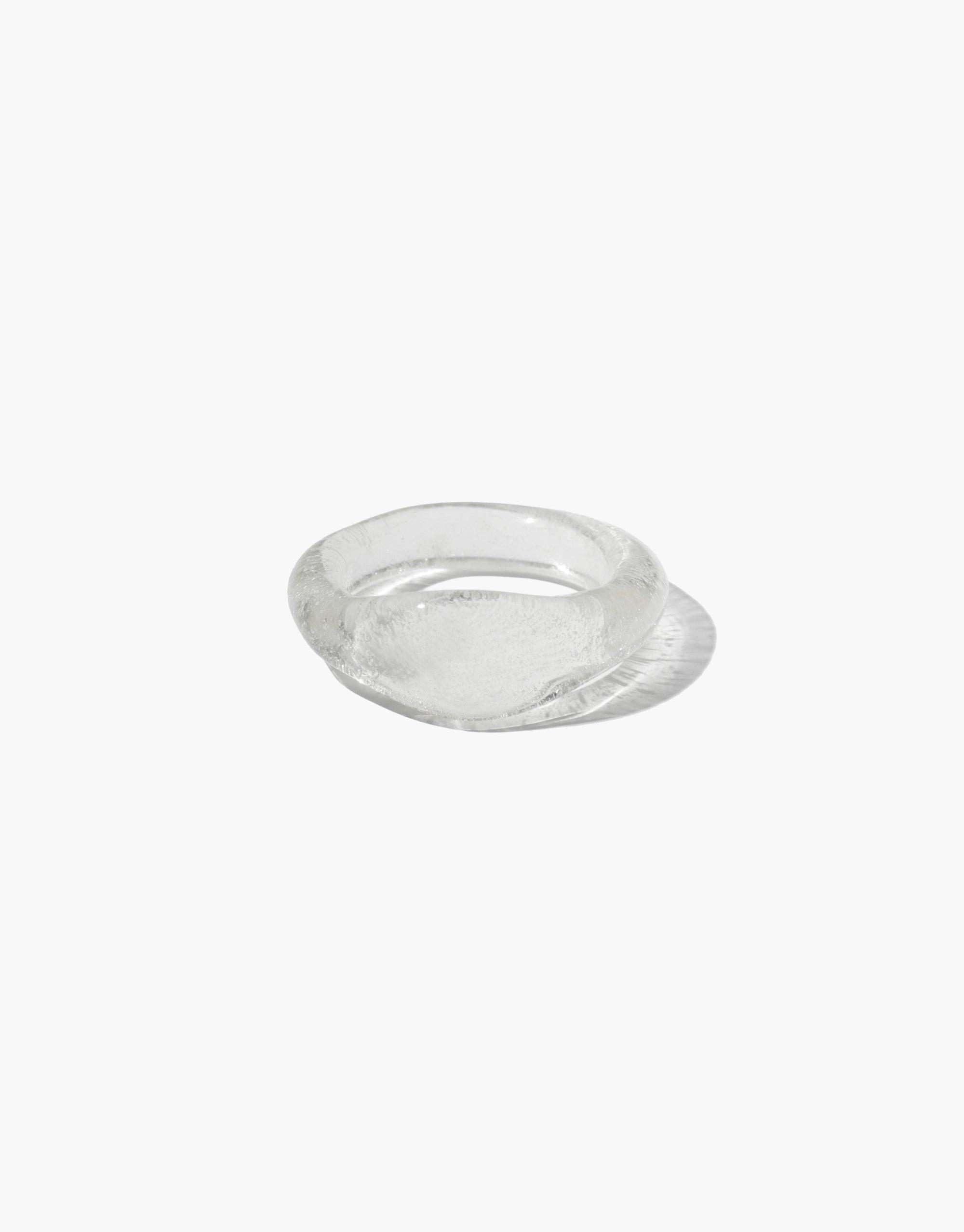 Clear eco-friendly glass signet ring with smooth surface and rounded edges, part of the Messenger Collection. Handcrafted from repurposed glass for sustainable jewelry. Signet Ring Original by CLED.