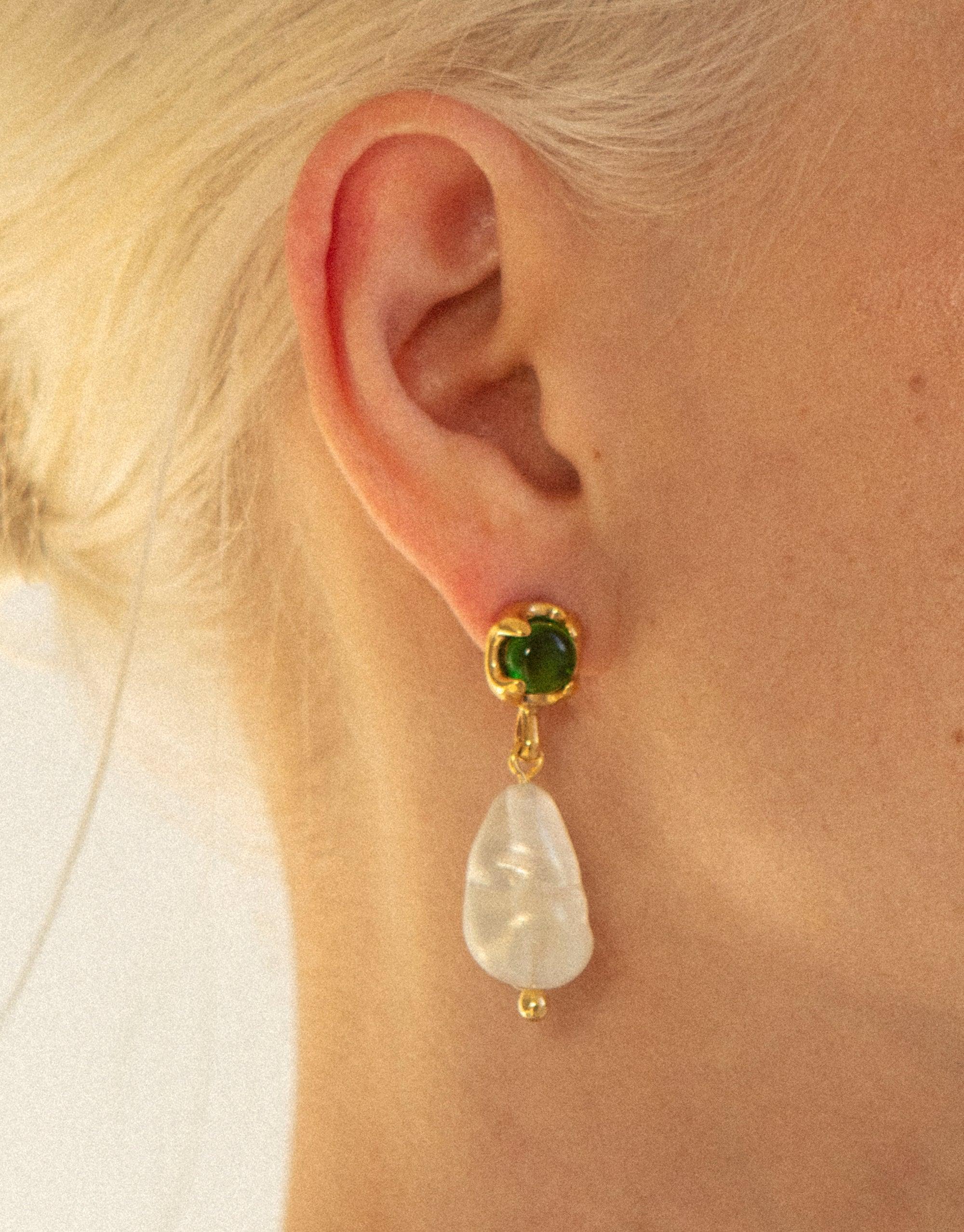 Elegant Beam Pearl Earrings featuring a green gemstone stud and a luminous pearl drop, showcasing eco-friendly jewelry design. Gold-plated setting complements the natural beauty of the recycled materials. Handcrafted sustainable earrings by CLED.