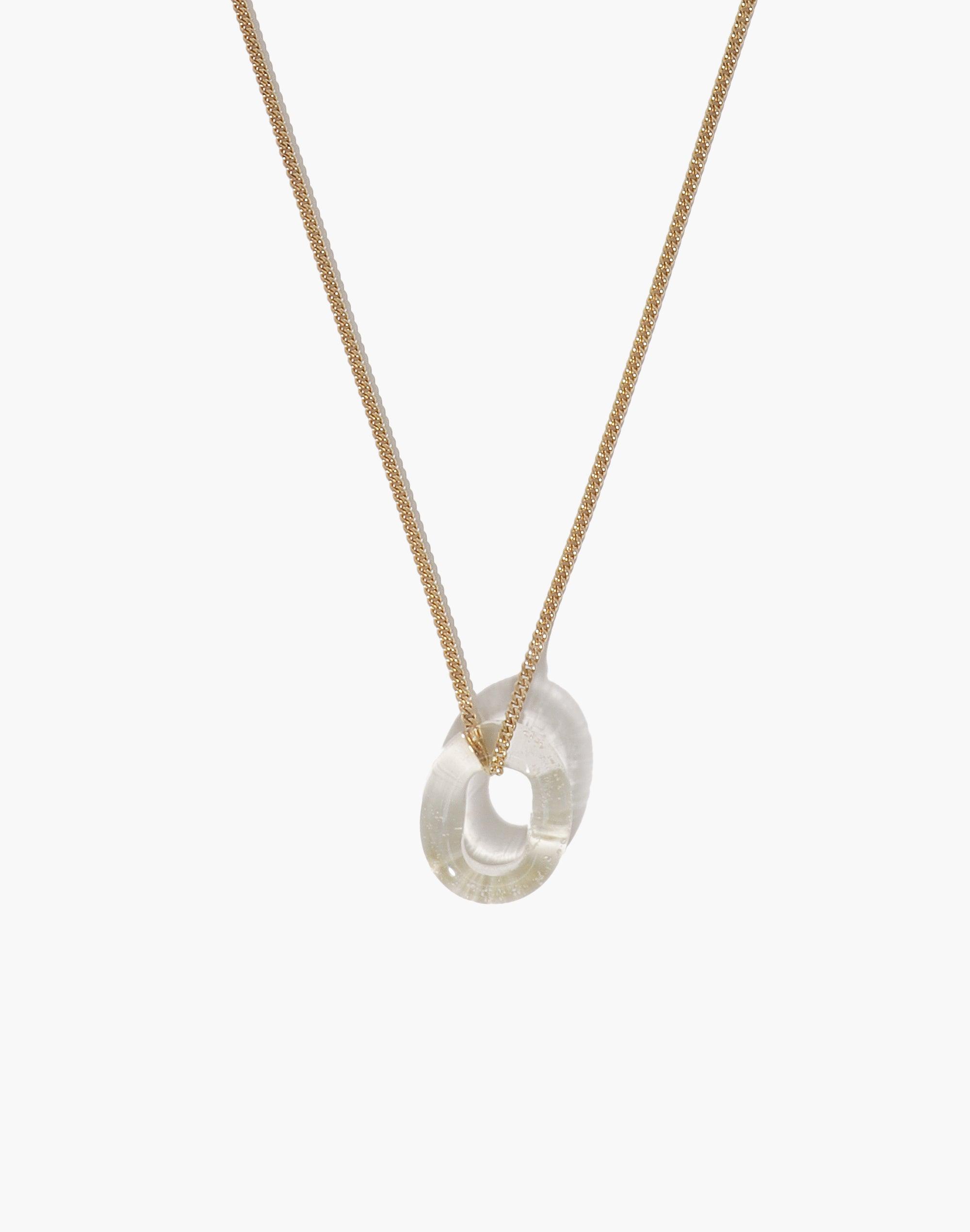 Elegant In The Loop Necklace featuring a minimalist transparent glass eco gem pendant on a delicate gold chain, showcasing sustainable luxury and versatile style. Handcrafted with repurposed glass for eco-conscious fashion. CLED