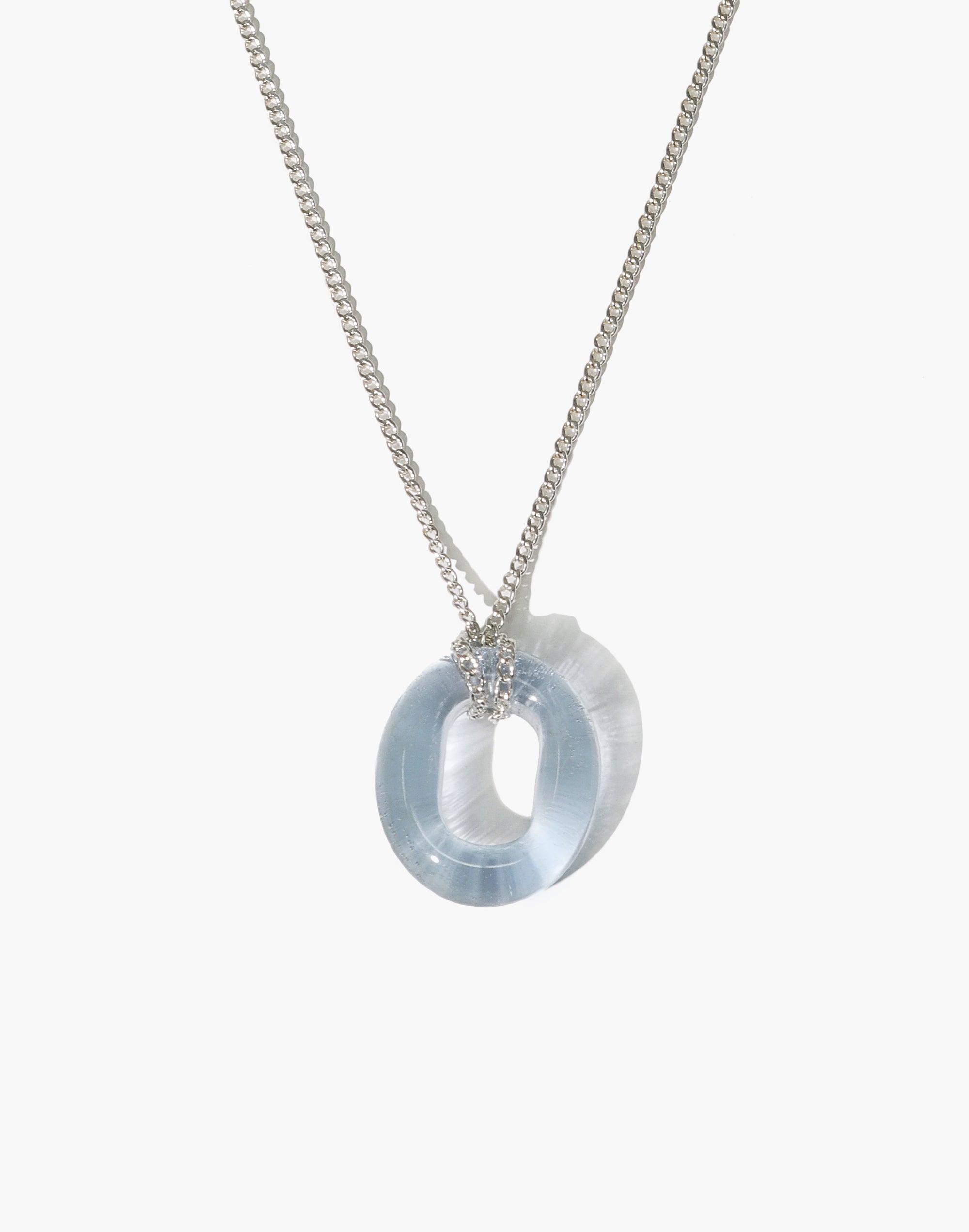 Minimal Loop eco gem necklace featuring a light blue glass pendant on a silver chain. Sustainable jewelry piece with an adjustable length. Handcrafted from repurposed glass. In The Loop Necklace by CLED.