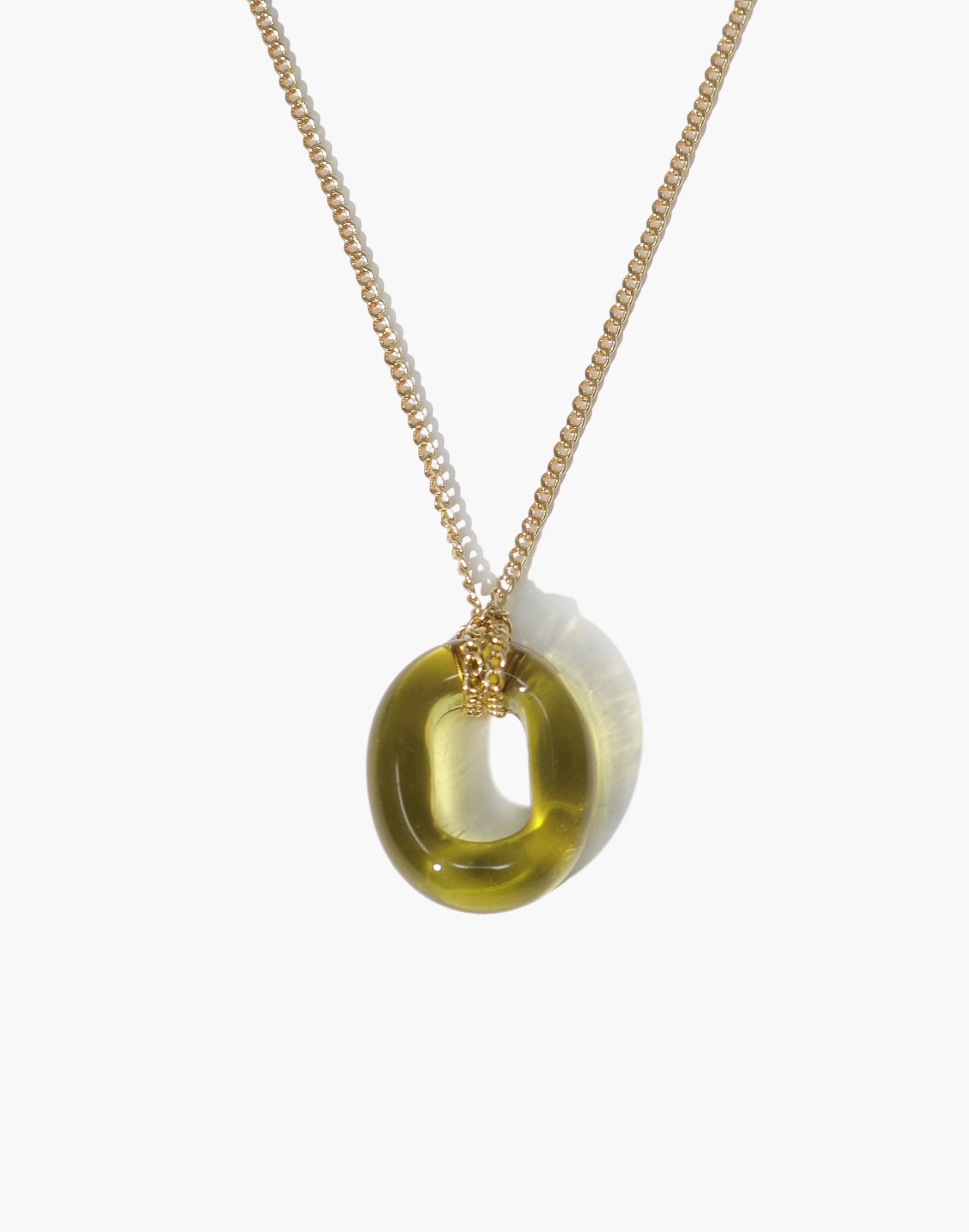 Elegant In The Loop Necklace featuring a translucent olive green eco-friendly glass pendant on a delicate gold-toned chain. Minimalist design with adjustable length. Handcrafted sustainable jewelry by CLED.