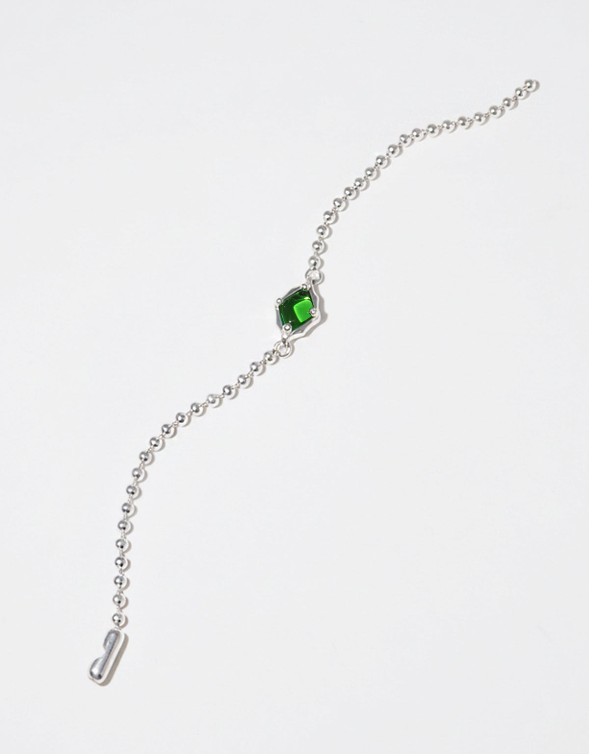 Interlace Bracelet in sterling silver, a fine ball chain carrying a single green forest glass Eco Gem set in a scalloped frame. Interlace Bracelet by CLED.