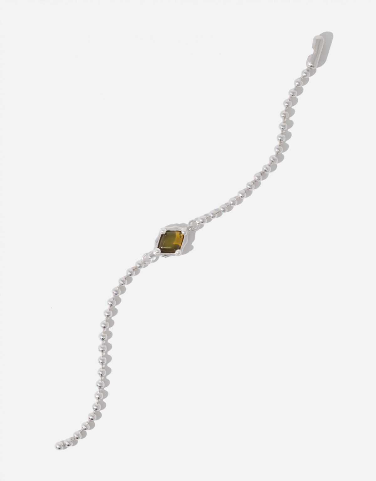 Interlace Bracelet with a light olive glass Eco Gem framed in scalloped silver on a delicate ball chain. Upcycled glass jewelry from the Las Collection. Interlace Bracelet by CLED.