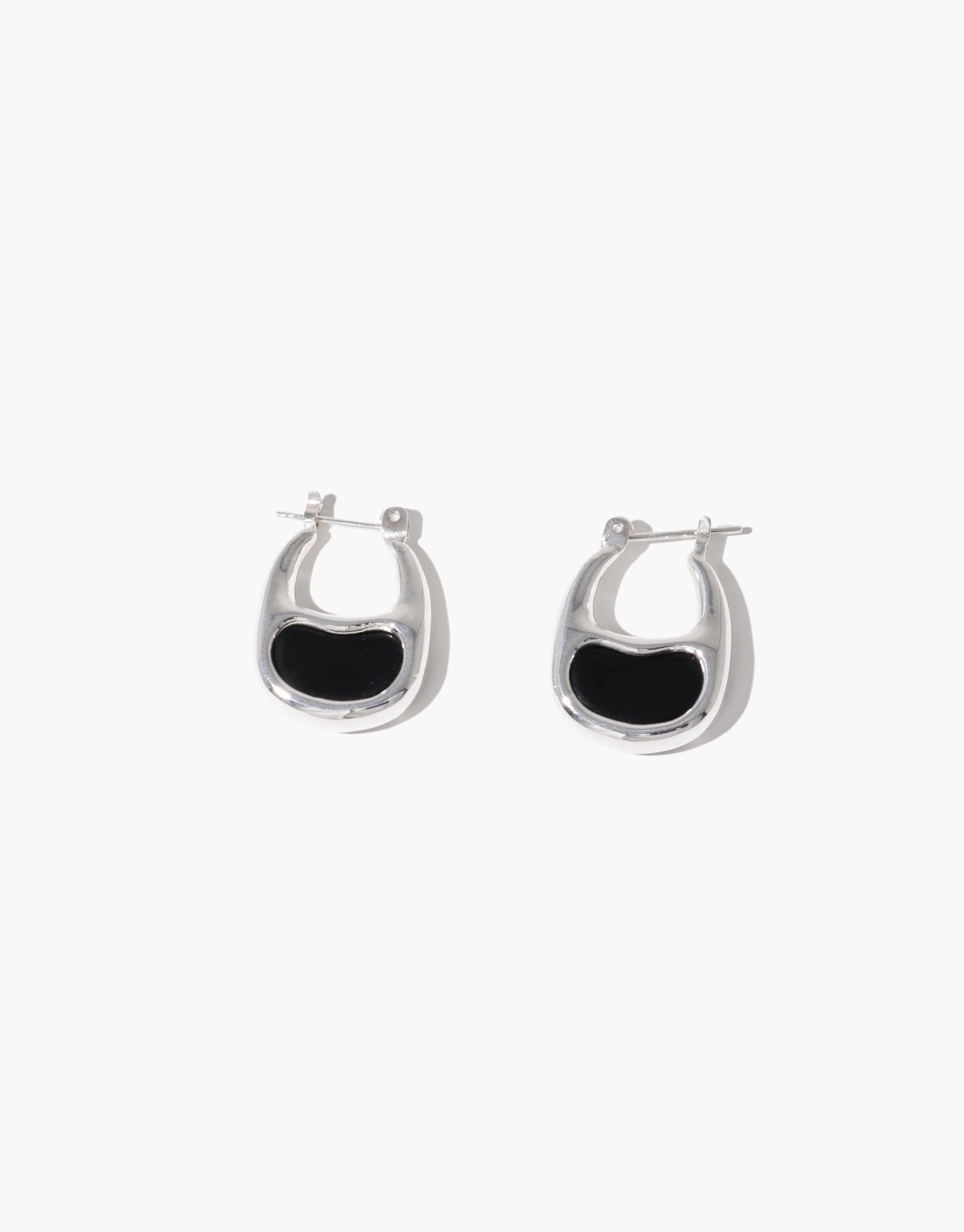 Elegant silver hoop earrings with black bean-shaped inlay, inspired by nature's organic forms. These small, stylish earrings capture the essence of growth and transformation. Bean Hoop Earrings | Small by CLED