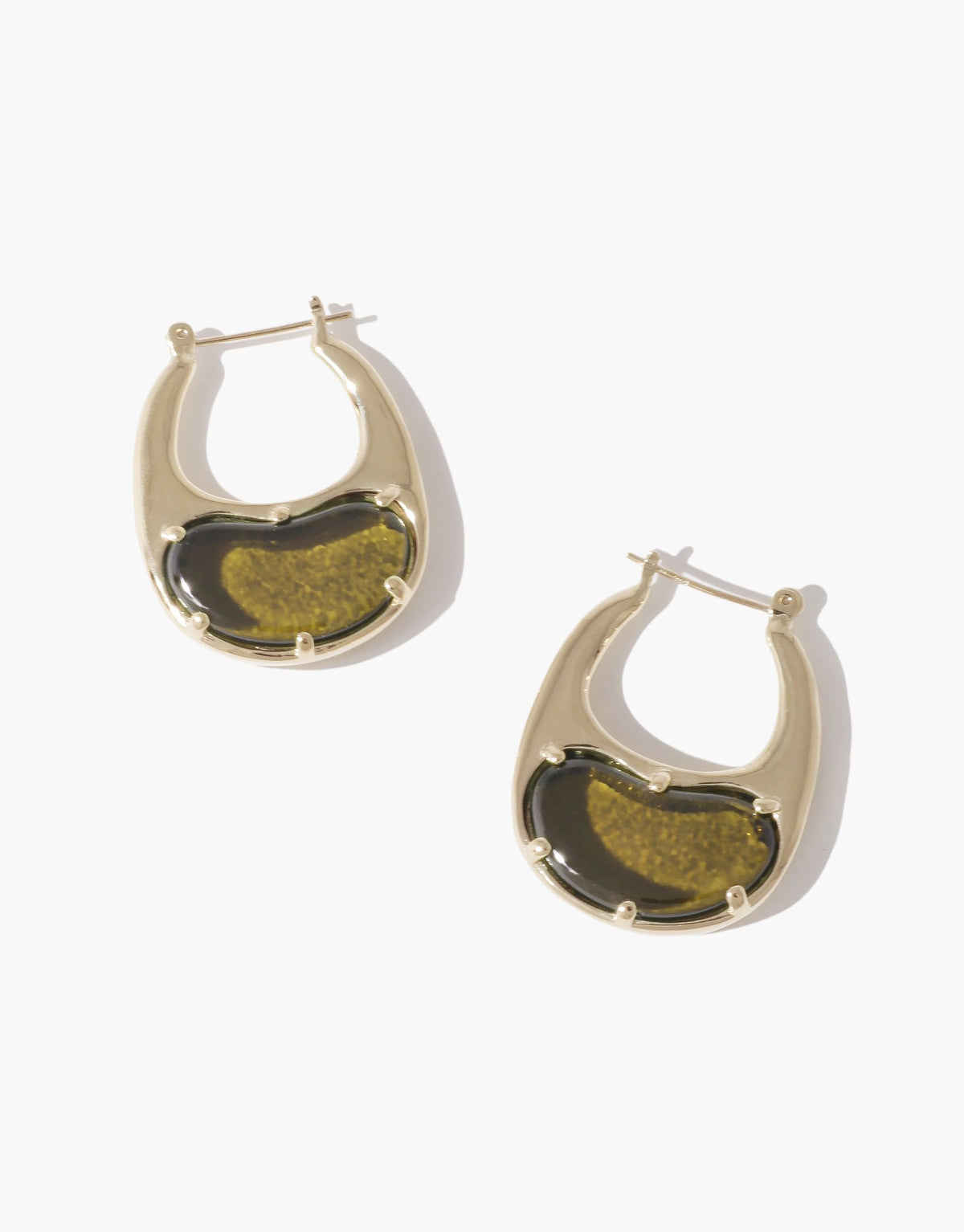 Large gold-toned hoop earrings with olive green bean-shaped inlays, inspired by natural legume shapes. Elegant and organic design showcasing nature's creativity. Bean Hoop Earrings | Large by CLED.