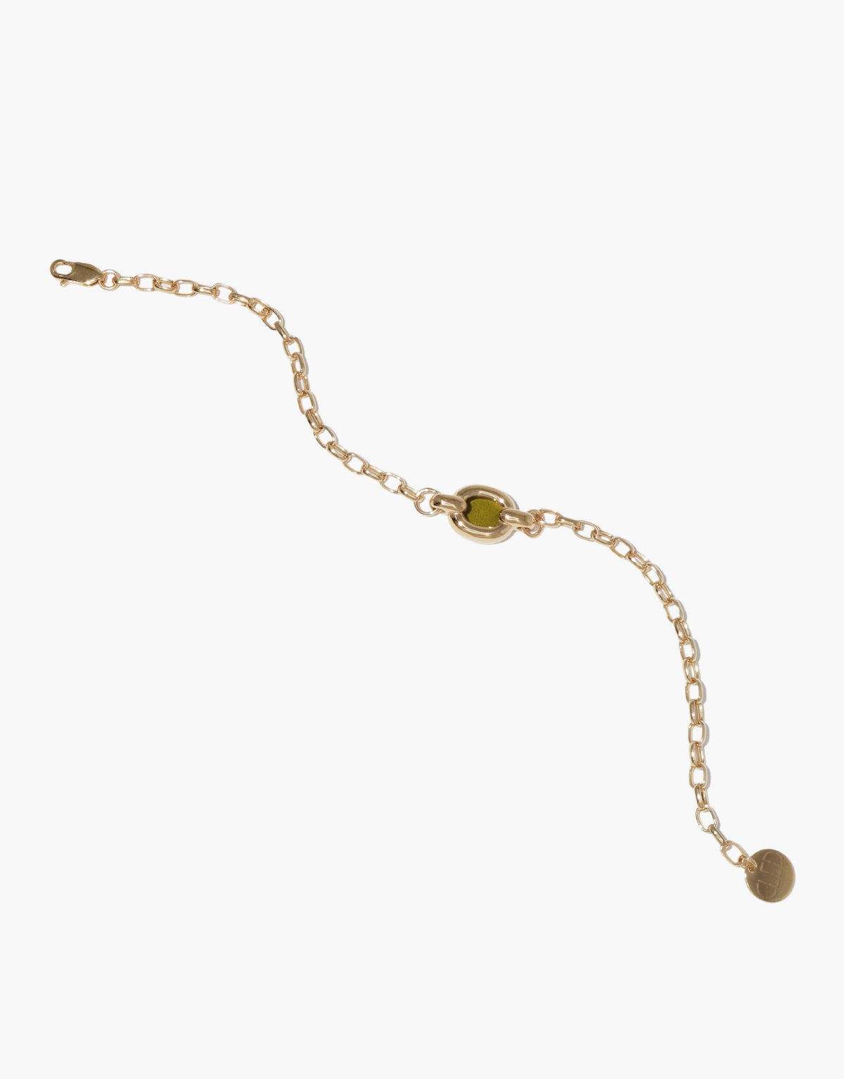 Elegant gold chain bracelet with green centerpiece, featuring delicate links and a small hanging charm. Symbolizes unity and upcycling in the Core Loop Bracelet design. Sustainable jewelry piece by CLED.