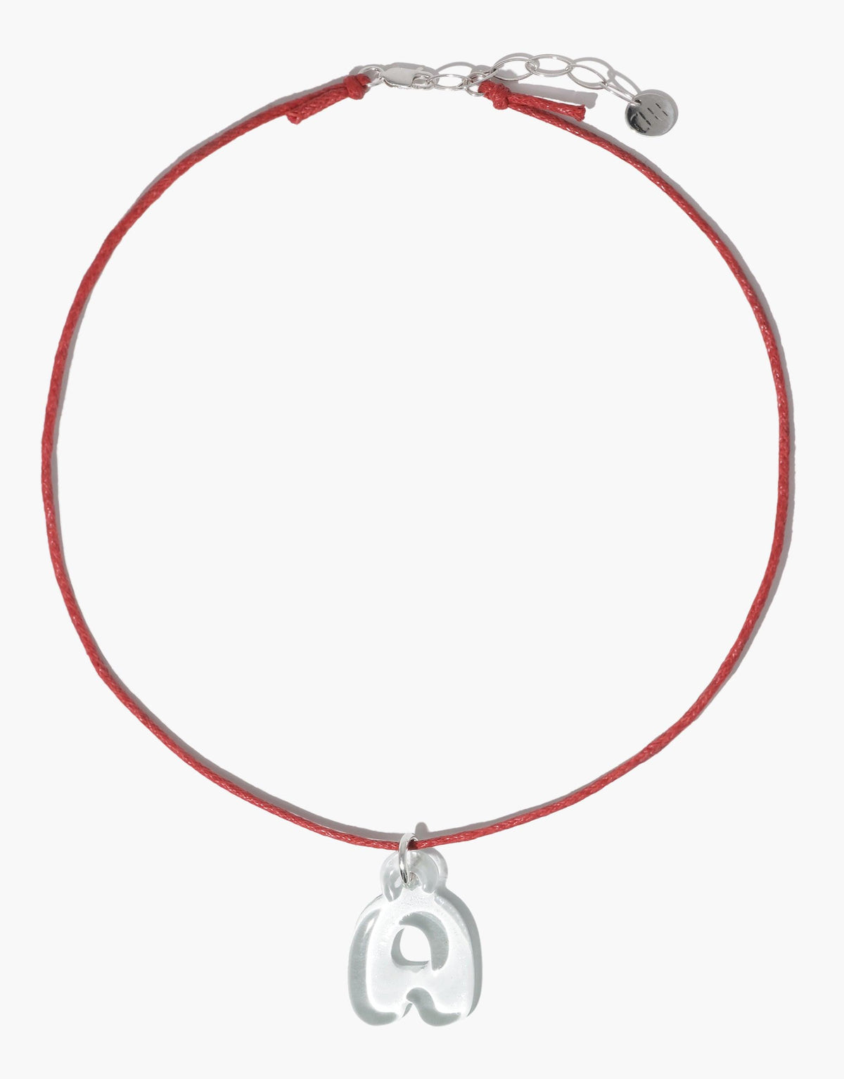 Red cord necklace with silver clasp and adjustable chain, featuring a bubble-shaped letter 'A' charm made from recycled glass. Minimalist and eco-friendly design for the Letter Charm | Alphabet product by CLED.