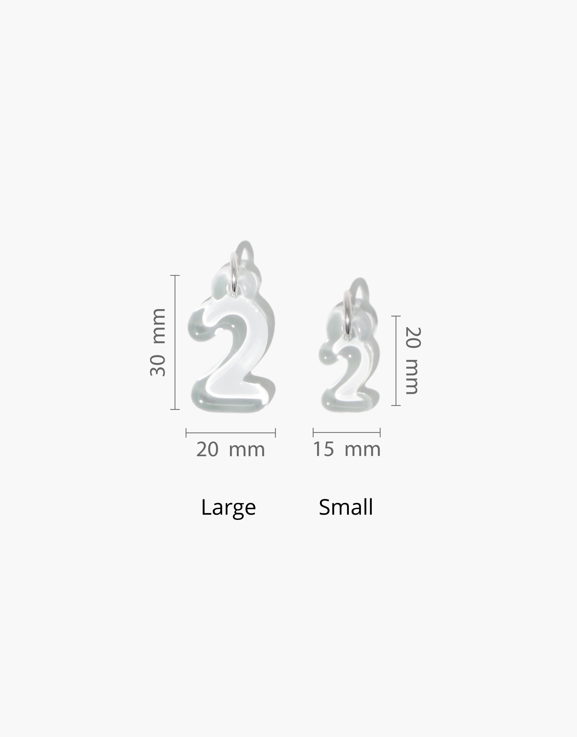 Number Charm size comparison showing large and small options with measurements. Transparent, bubble-style number 2 charms in two sizes, demonstrating eco-friendly design. Perfect for personalized jewelry and sustainable fashion accessories. CLED Number Charm.