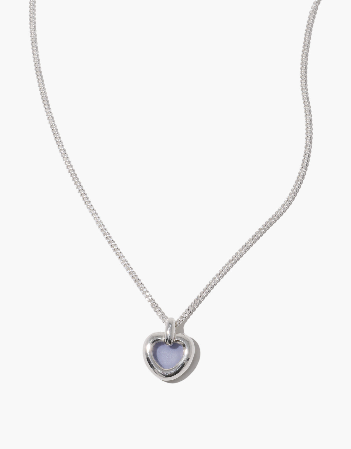 Core Heart Necklace | Small features a silver chain with a lightweight, softly rounded light blue heart pendant, embodying CLED's eco-conscious design by transforming discarded glass into elegant jewelry.