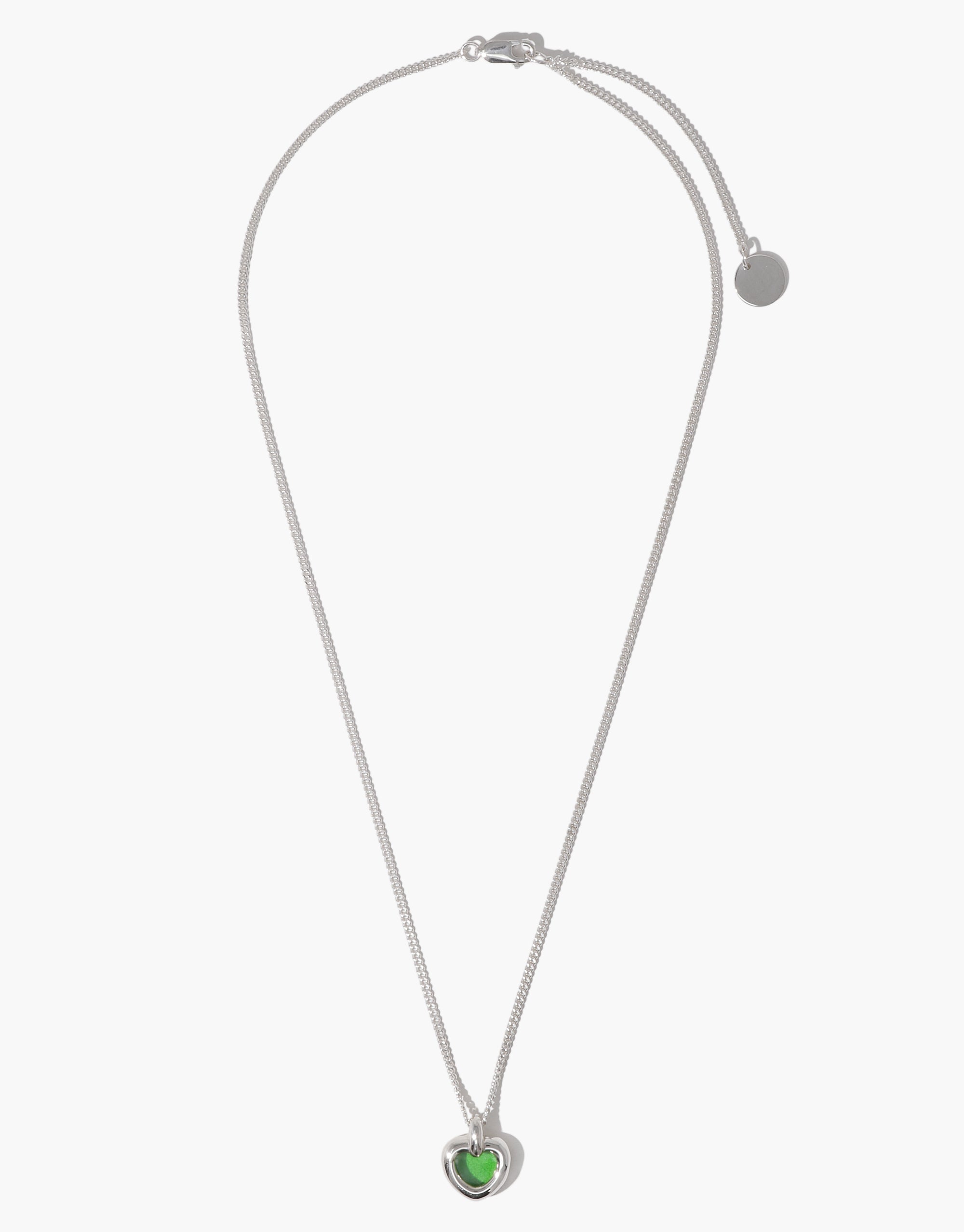 Core Heart Necklace | Small features a silver chain with a lightweight, softly rounded green heart pendant, embodying CLED's eco-conscious design by transforming discarded glass into elegant jewelry.