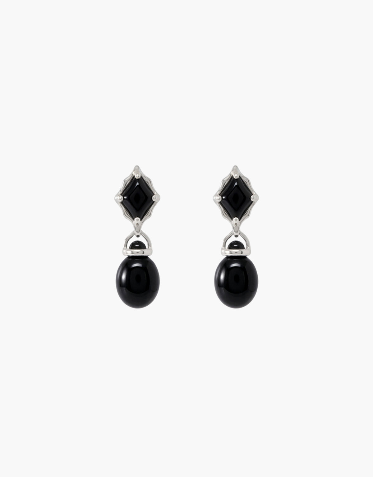 Las Drop Earrings featuring deep black glass Eco Gems paired in a vertical drop, a cut stone above a rounded bead on sterling silver. Sustainable upcycled glass jewelry from the Las Collection. Las Drop Earrings by CLED.