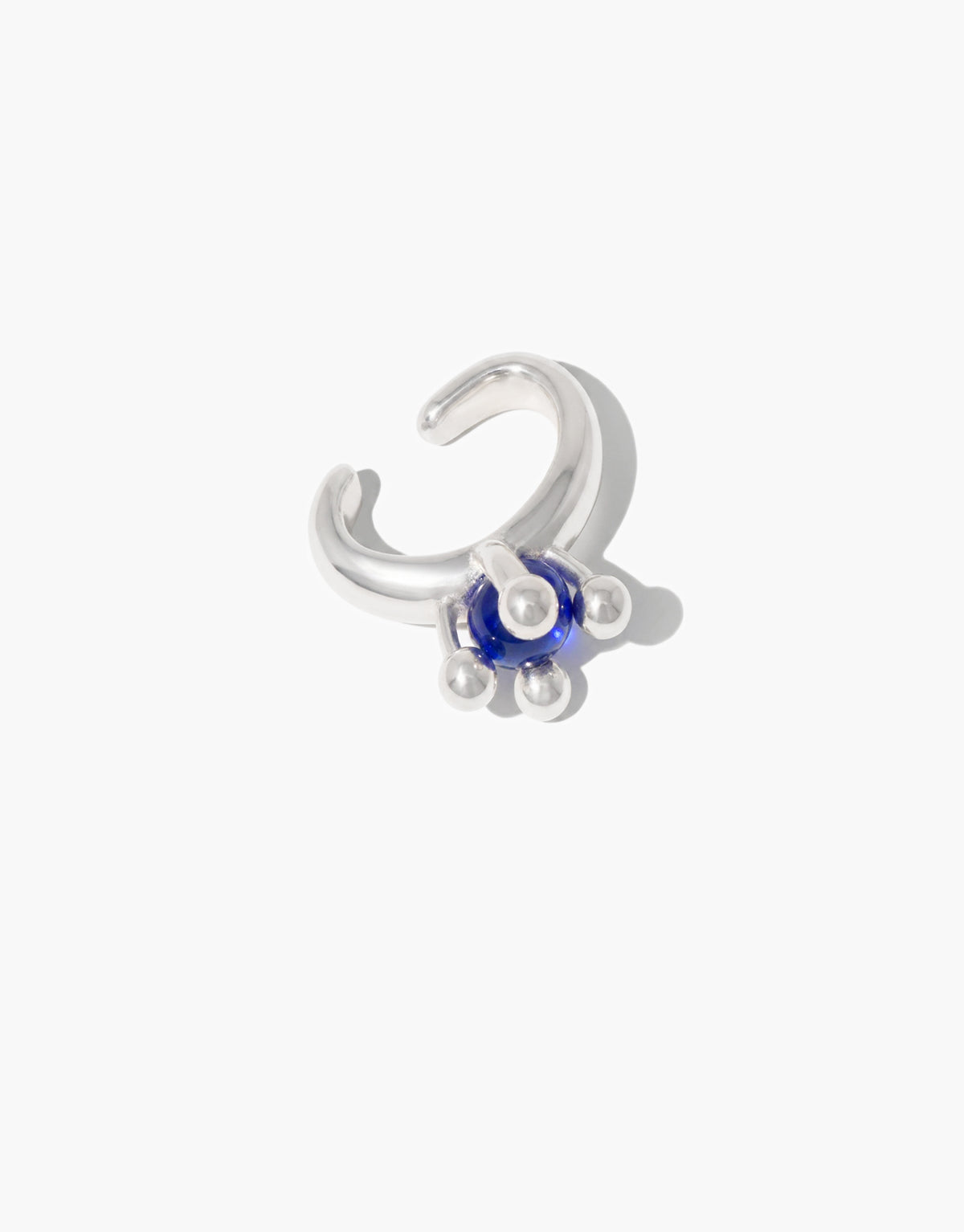 Picot Ear Cuff featuring a blue ocean glass Eco Gem framed by small silver picot beads on an open sterling silver curve. No piercing required. Picot Ear Cuff by CLED.
