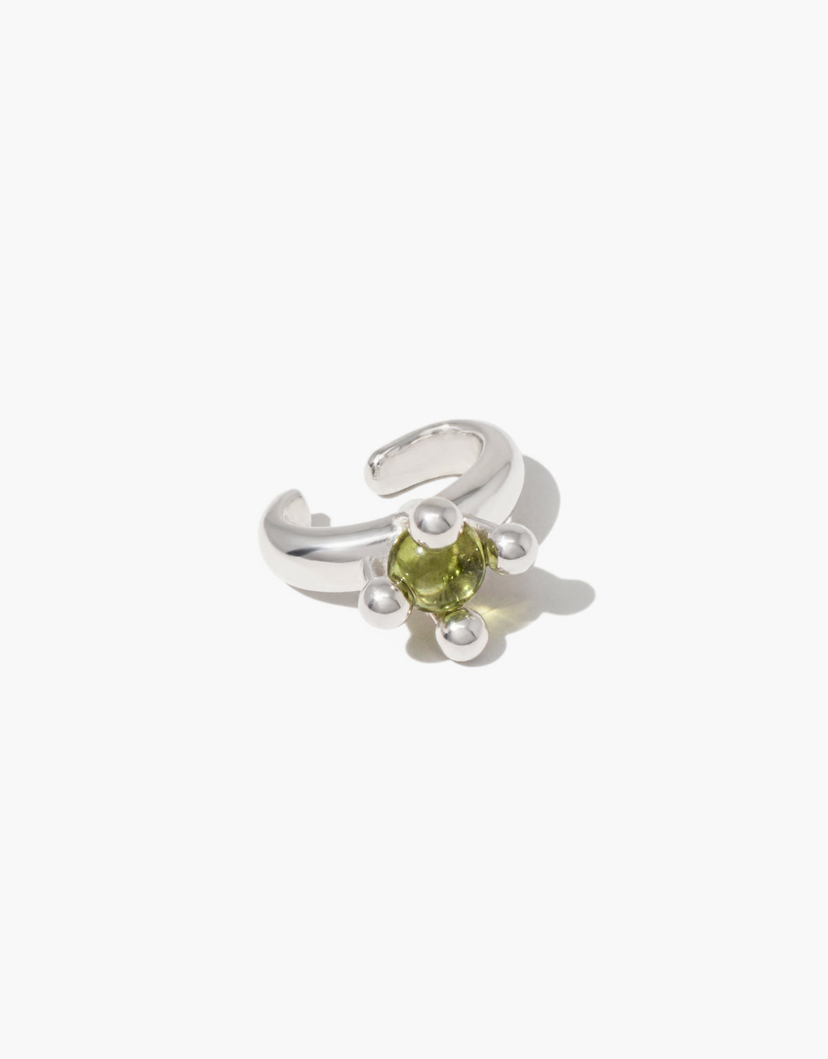 Picot Ear Cuff in sterling silver holding a soft light olive glass Eco Gem between small beaded picot details. Sustainable upcycled glass jewelry. Picot Ear Cuff by CLED.