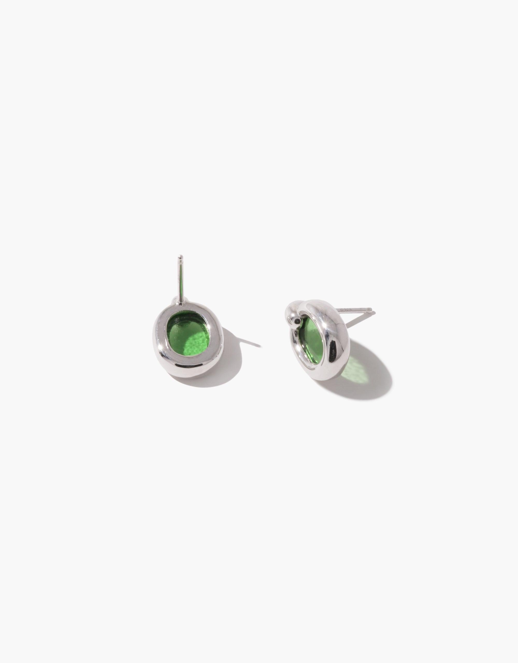 Elegant small silver hoop earrings with green circular accents, showcasing sustainable design and minimalist style. Core Loop Earrings | Small by CLED, part of the upcycled In The Loop collection, symbolizing unity and environmental consciousness.