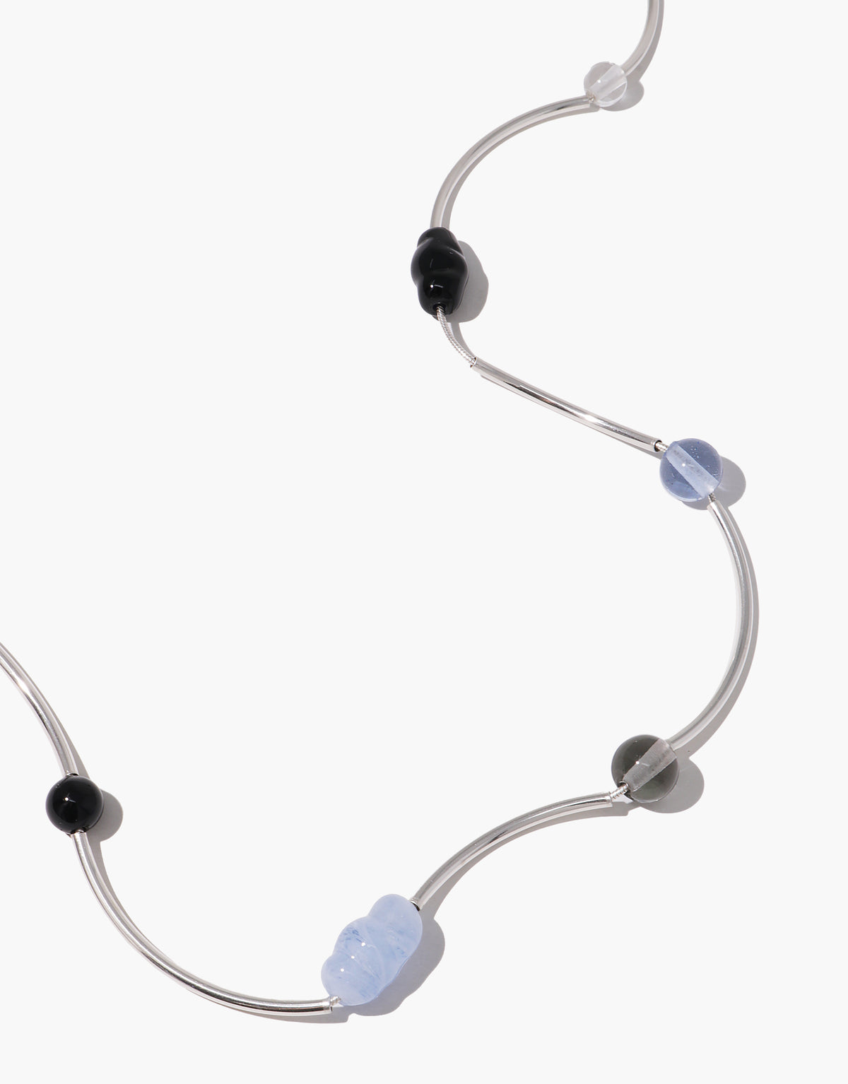 Halo Necklace featuring curved silver tubes with alternating black and light blue glass beads in wave design by CLED