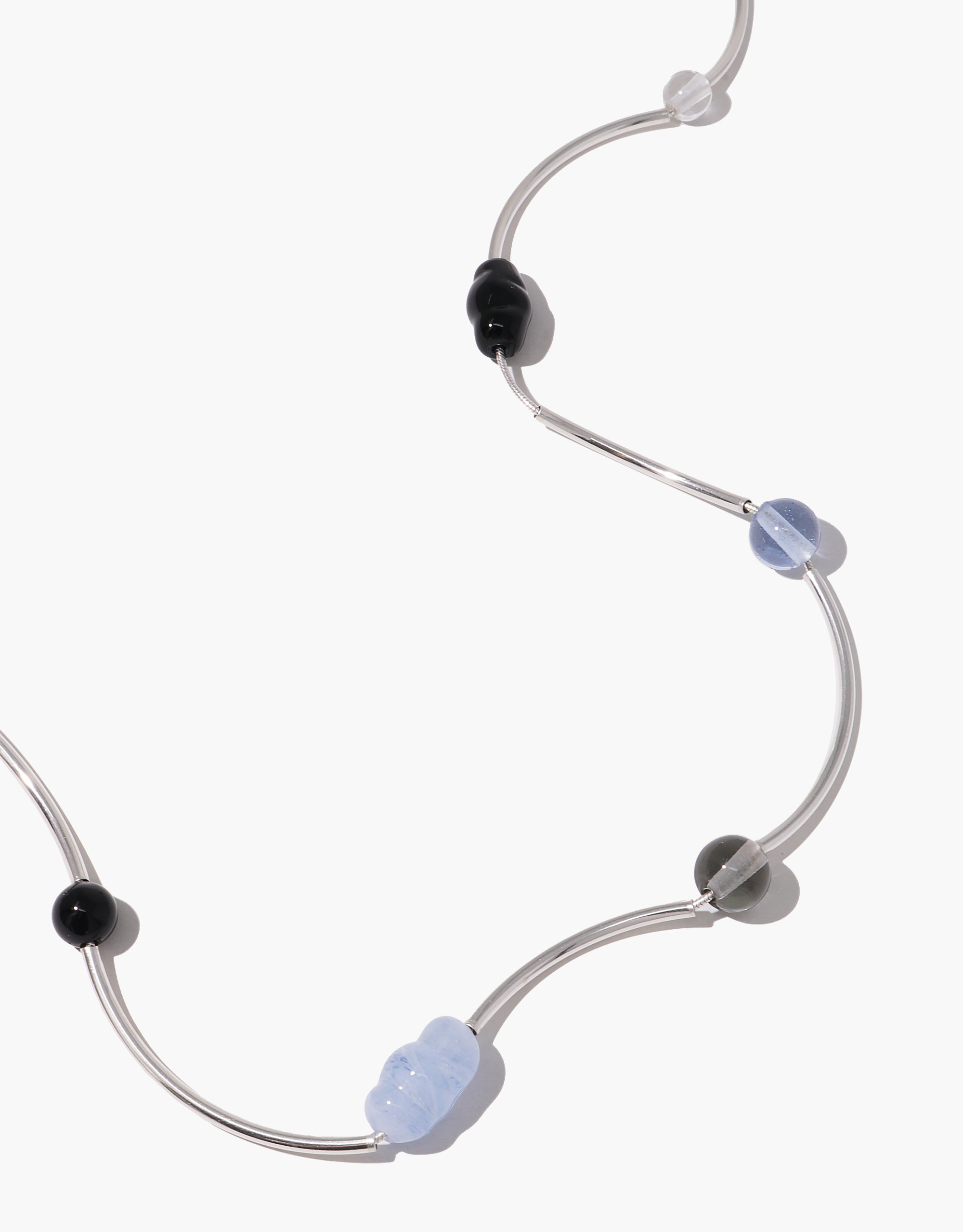Halo Necklace featuring curved silver tubes with alternating black and light blue glass beads in wave design by CLED