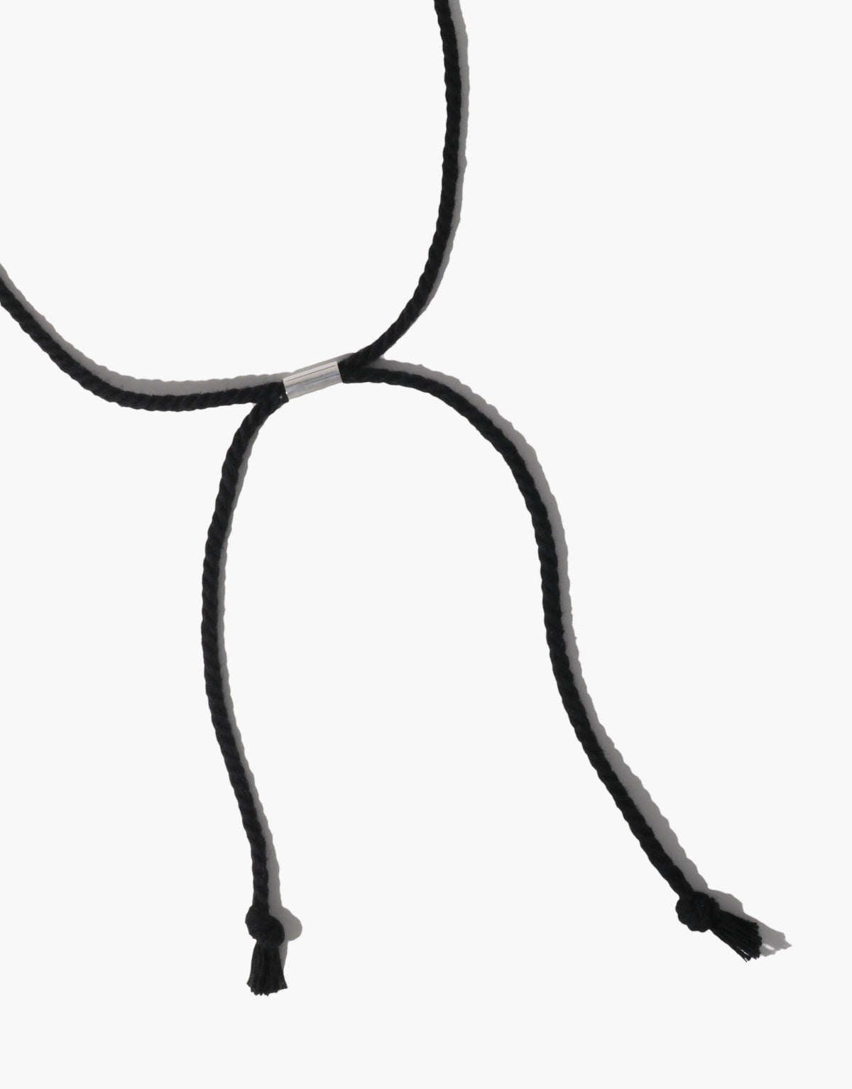 Elegant Black Pea Necklace featuring organic curves inspired by nature's legume shapes. Delicate black cord with adjustable length, showcasing minimalist design and natural transformation. Perfect accessory for nature-inspired style. Black Pea Necklace by CLED.