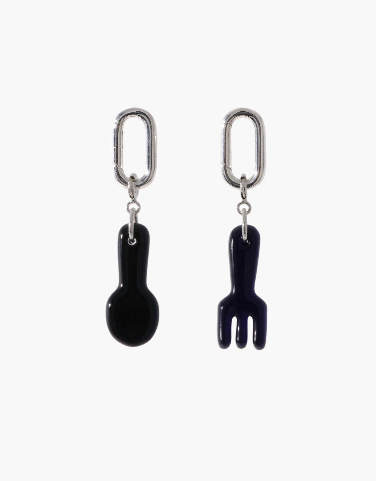 Silver Loop Stud Earrings with mismatched black utensil charms - a spoon and fork - hanging from oval-shaped connectors. Versatile jewelry for mixing and matching with other charms. Loop Stud Earring by CLED.