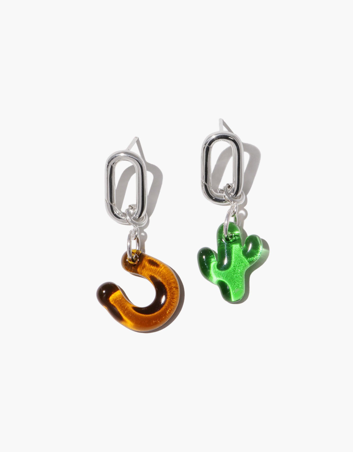 Silver Loop Stud Earrings with interchangeable charms, featuring a horseshoe and cactus pendant. Versatile jewelry piece for customizable style. Loop Stud Earring by CLED