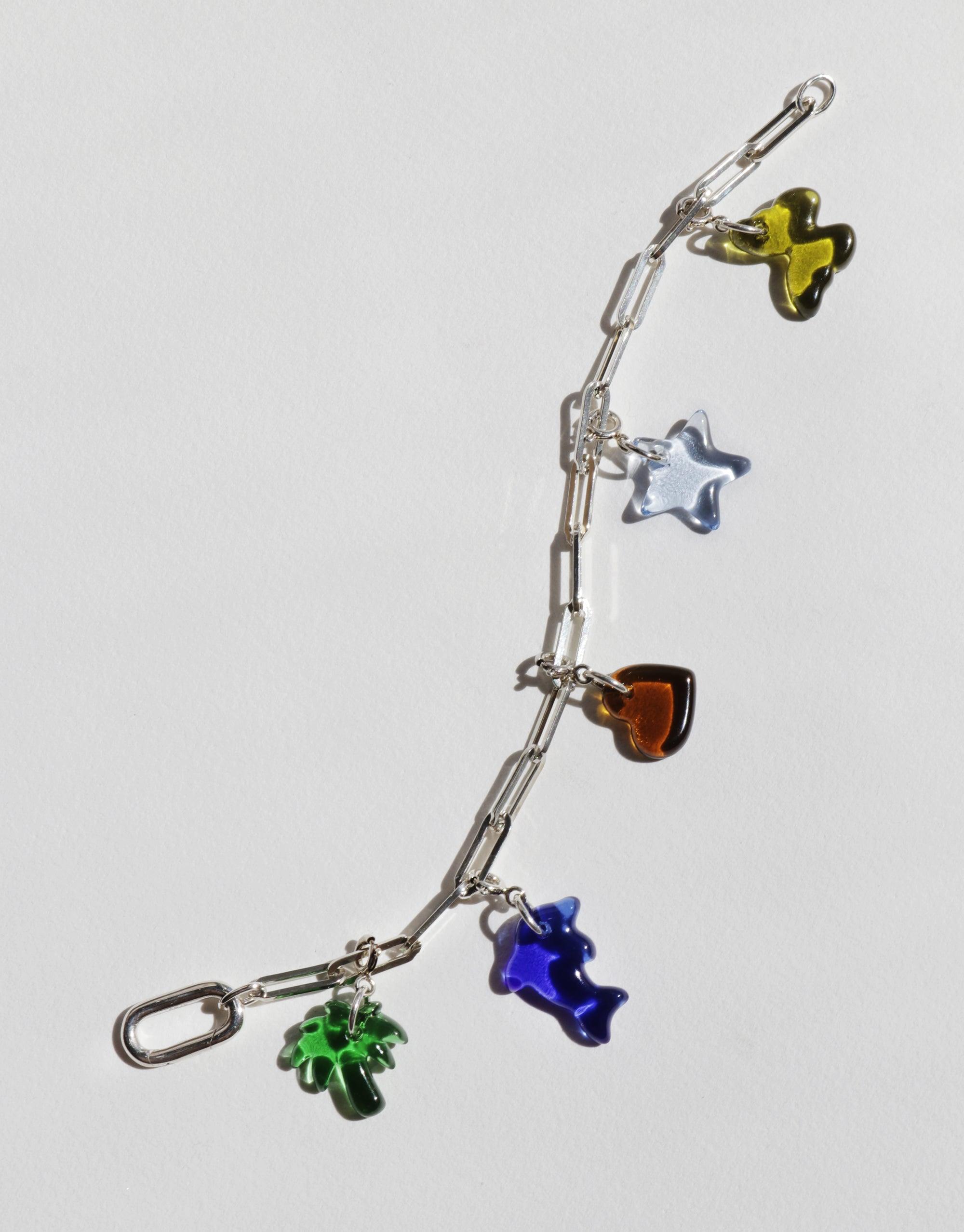 Silver chain bracelet with colorful glass charms including butterfly, star, heart, and flower shapes. Customizable accessory for creating unique styles. Icon Chain Bracelet | D by CLED