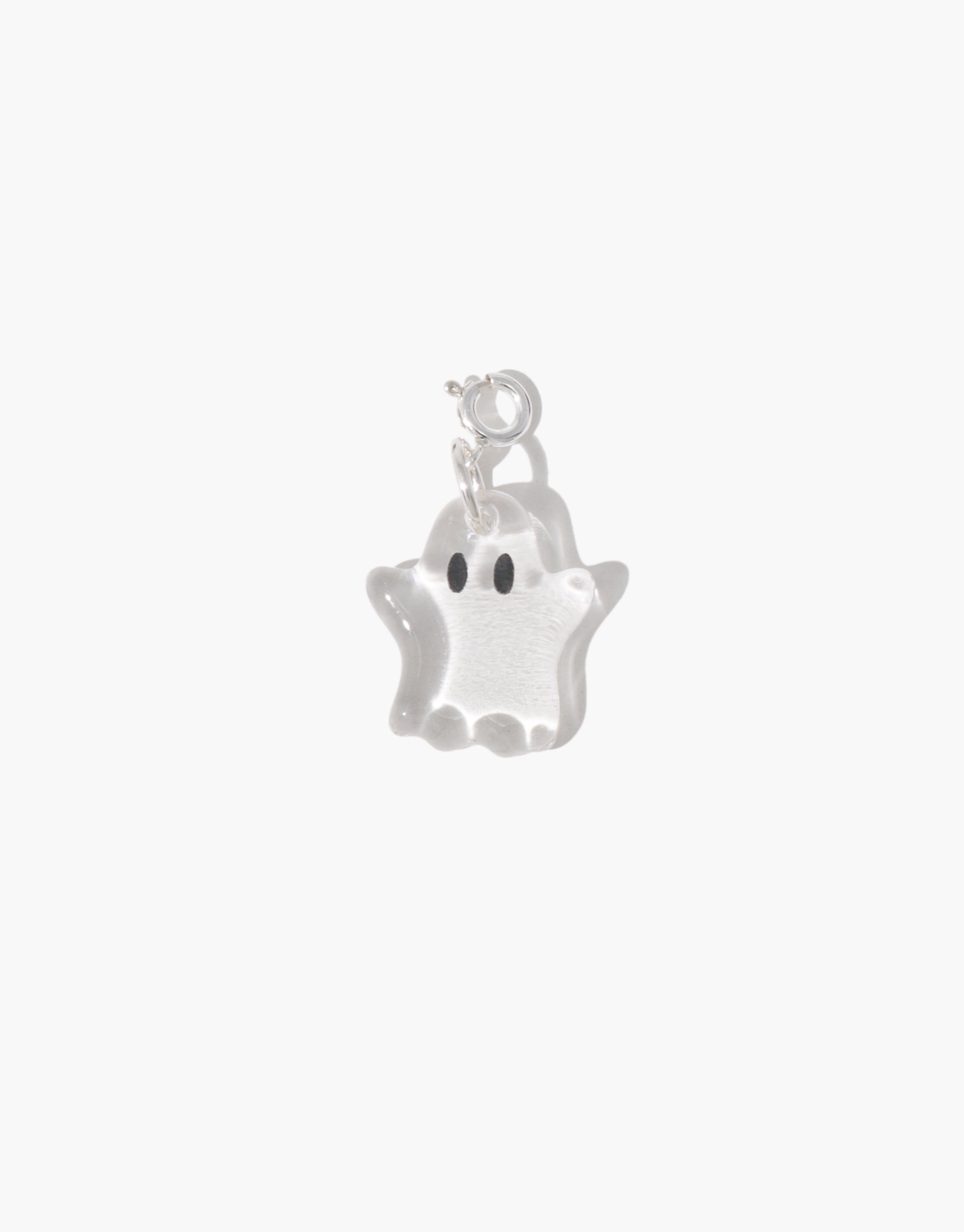 Silver ghost charm on a white background
