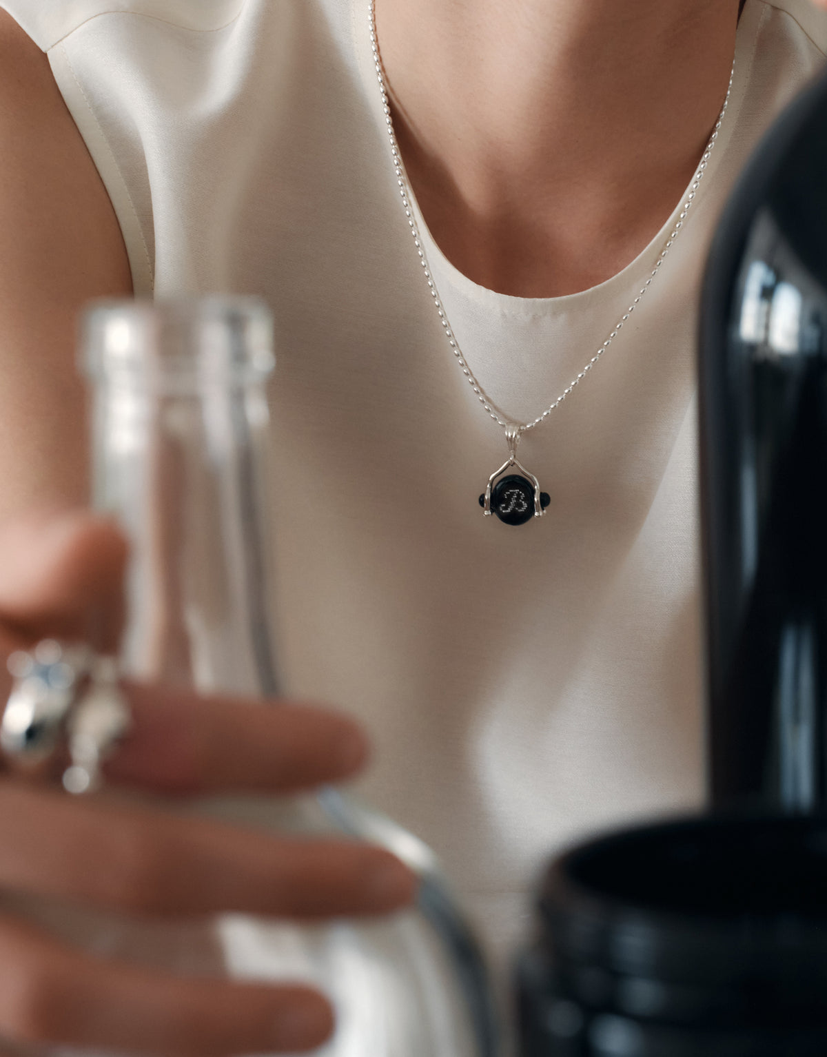 LAS Oval Swivel Pendant worn on the model on a fine sterling silver chain, the Eco Gem resting at the collarbone. Handmade in Los Angeles. LAS Oval Swivel Pendant by CLED.