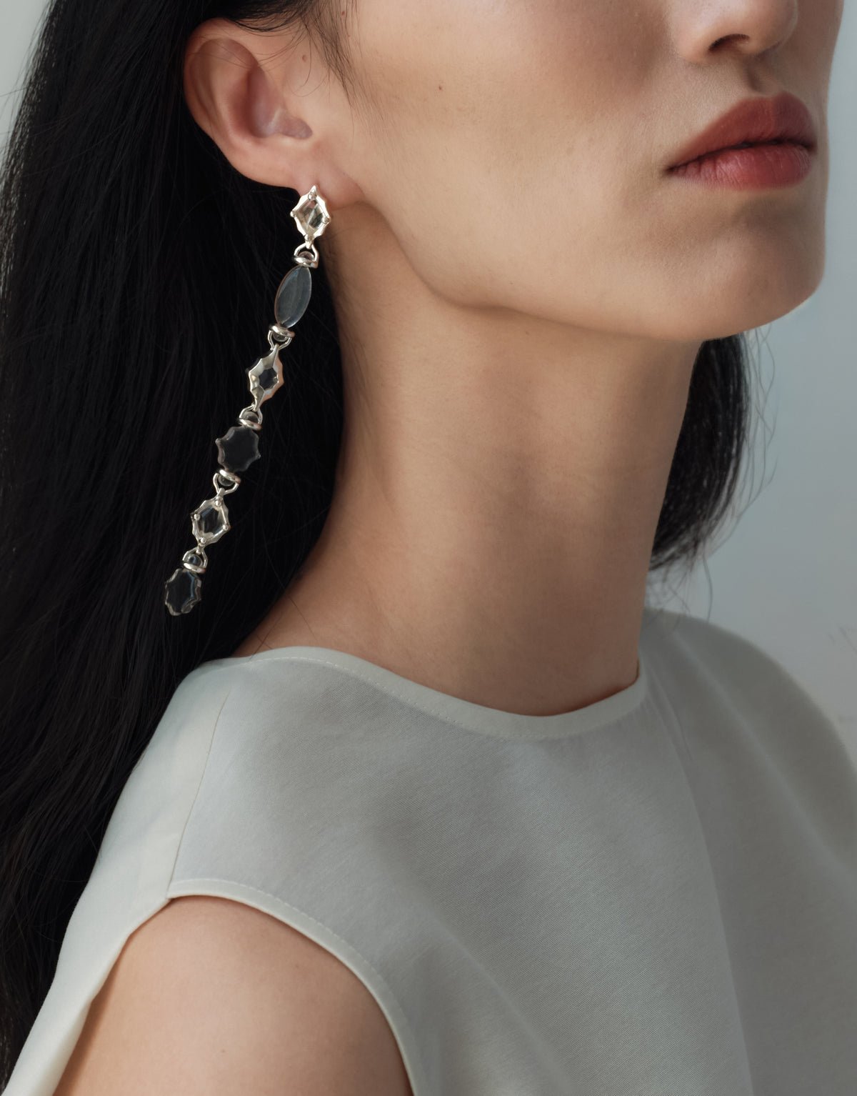 Cadence Linear Earring in black basalt glass, dark Eco Gems linked in a single long drop of sterling silver. Cadence Linear Earring by CLED.