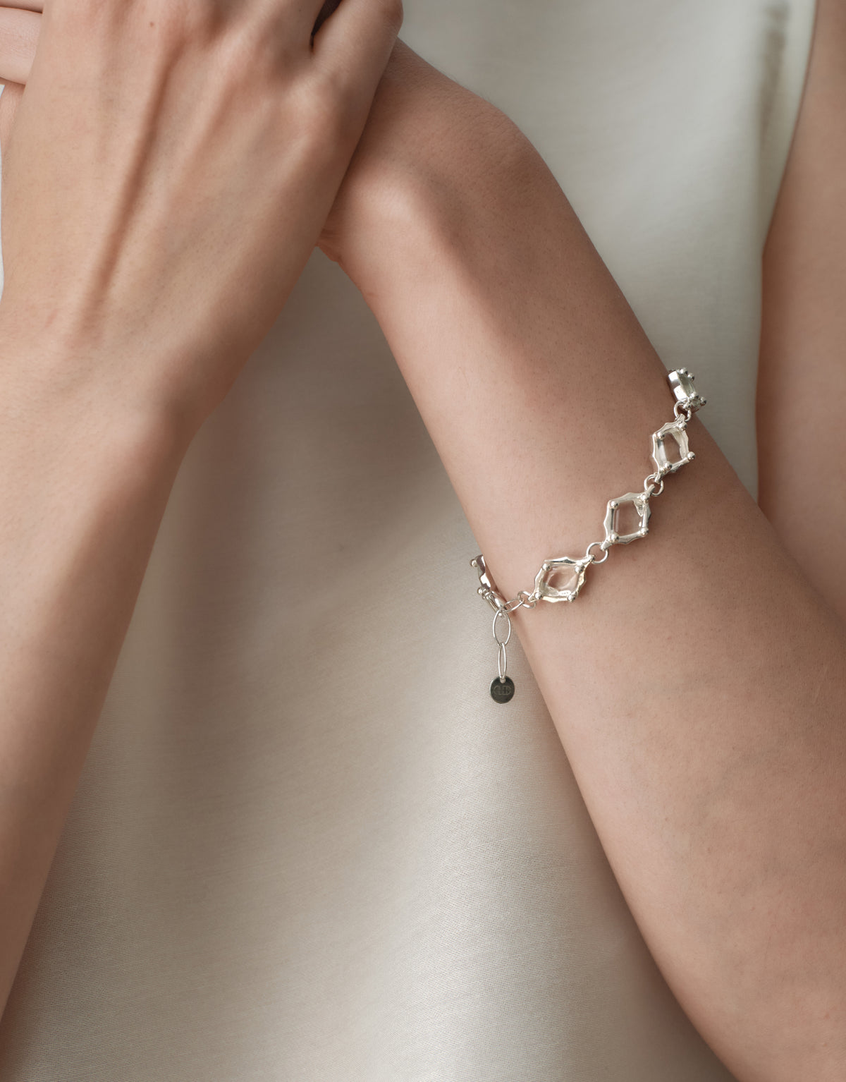 Cadence Bracelet | Metal worn on the model, upcycled glass Eco Gems framed in sterling silver. Handmade in Los Angeles. Cadence Bracelet | Metal by CLED.