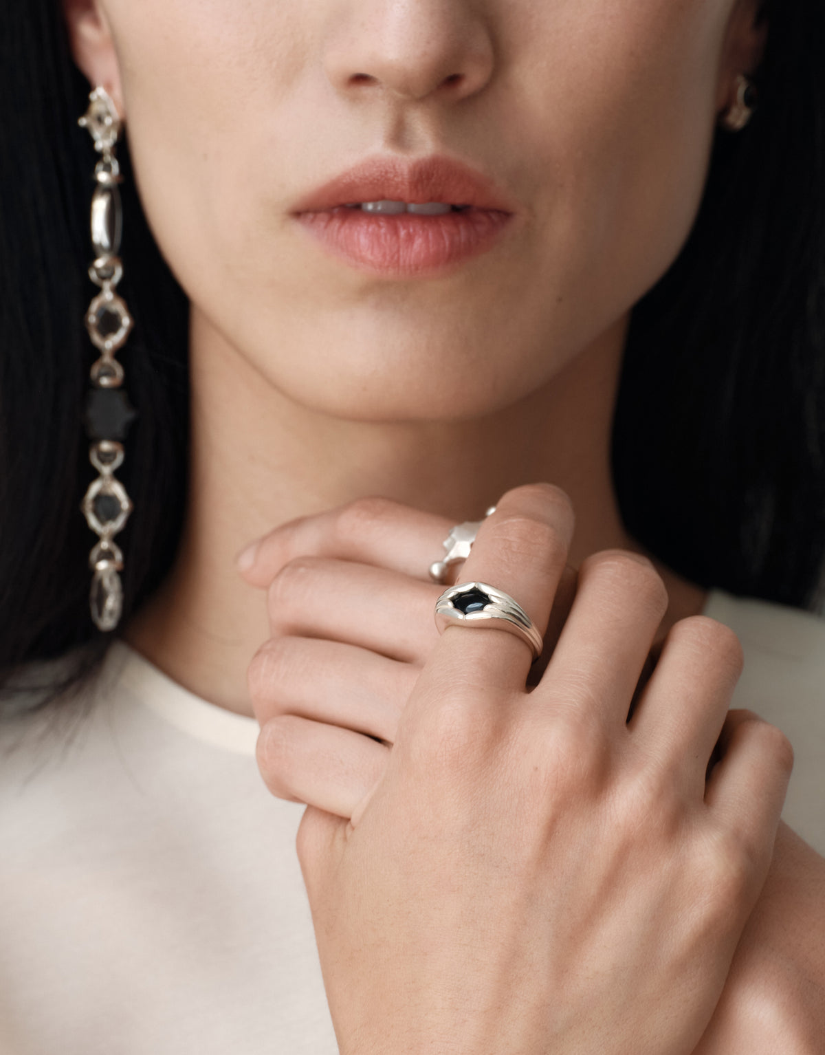 Cadence Linear Earring in black basalt glass, dark faceted Eco Gems alternating with sterling silver links in one long drop. Handmade in Los Angeles. Cadence Linear Earring by CLED.